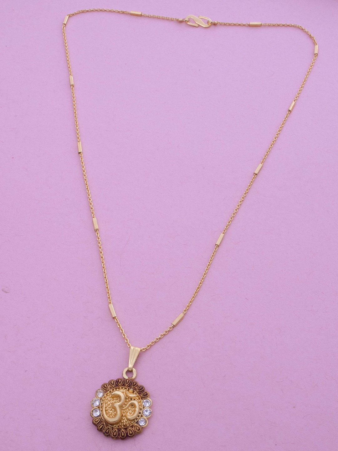 Ramdev Art Fashion Jwellery Gold-Plated Stone Studded Om Shaped Pendant With Chain
Ramdev Art Fashion Jwellery Gold-Plated Stone Studded Om Shaped Pendant With Chain