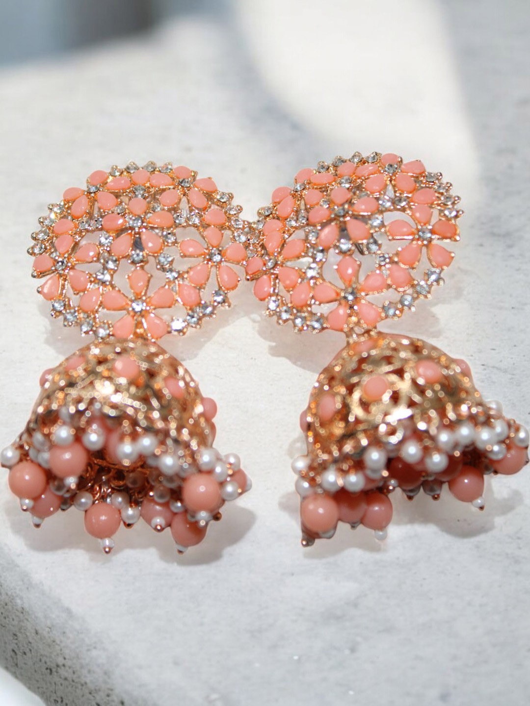 Jolly Faces Rose Gold-Plated Artificial Stones Studded and Beaded Dome Shaped Jhumkas, Peach
Jolly Faces Rose Gold-Plated Artificial Stones Studded and Beaded Dome Shaped Jhumkas, Peach