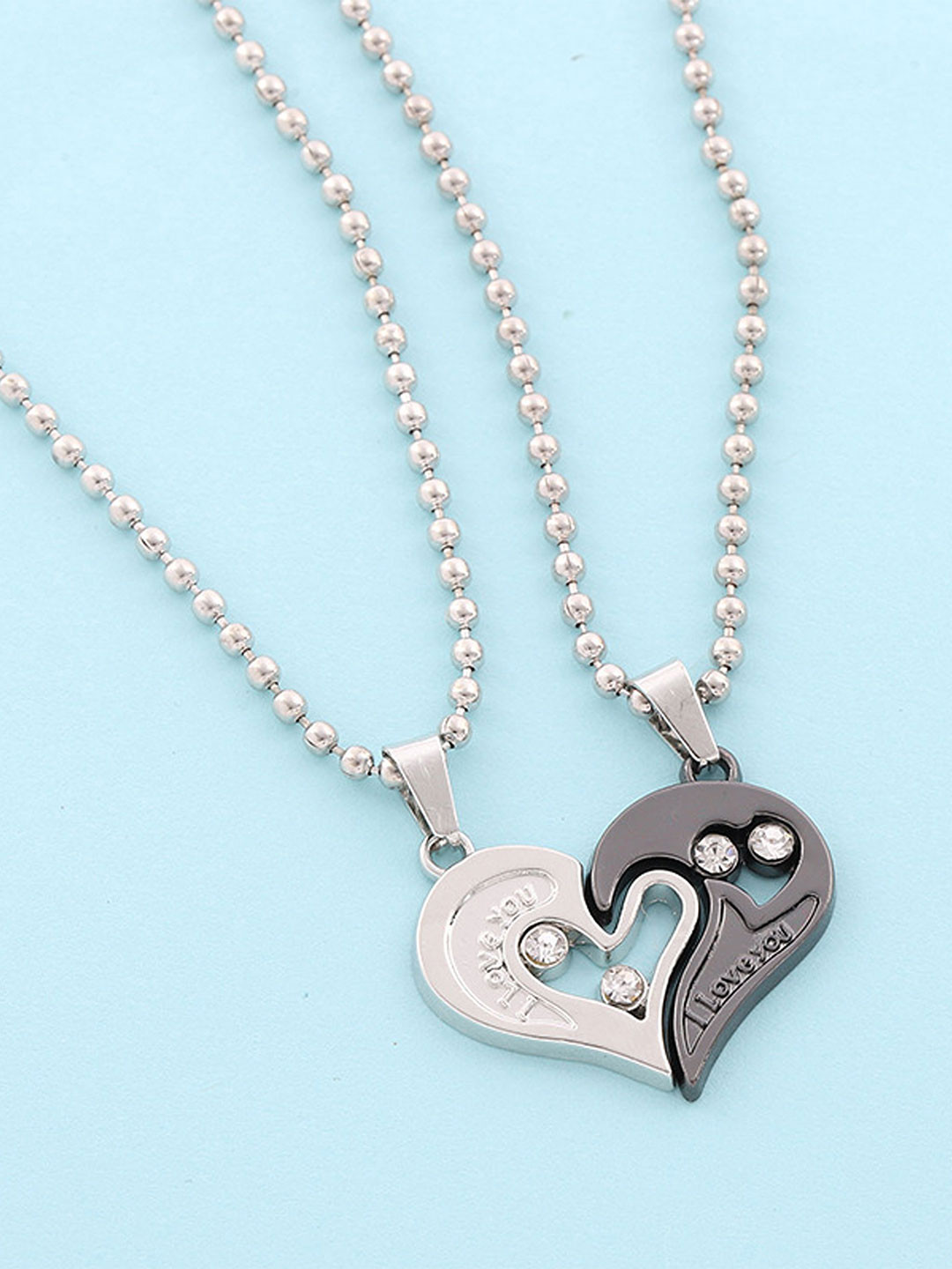 DressBerry Stainless Steel Set Of 2 Silver-Plated Heart Shaped Pendants with Chains
DressBerry Stainless Steel Set Of 2 Silver-Plated Heart Shaped Pendants with Chains