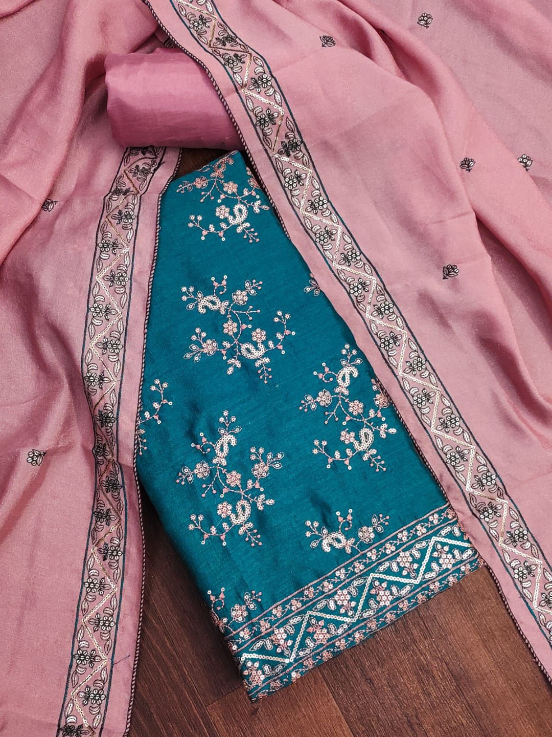 BlissFlair Paisley Embroidered Sequinned Vichitra Silk Unstitched Dress Material, Blue
BlissFlair Paisley Embroidered Sequinned Vichitra Silk Unstitched Dress Material, Blue