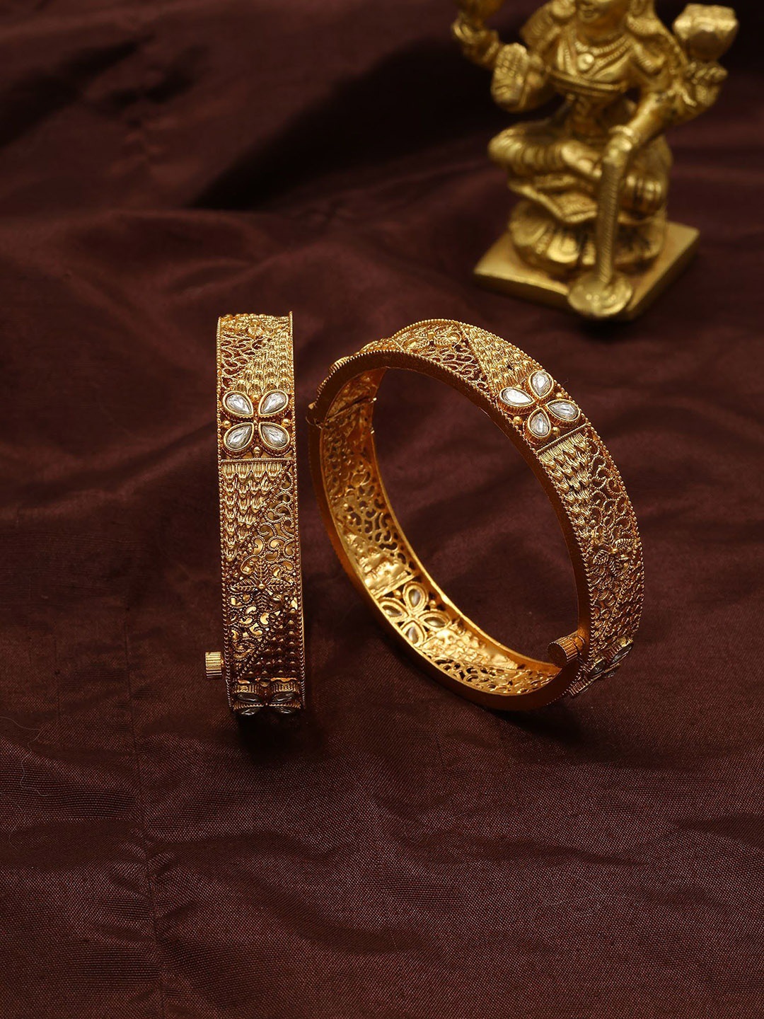 Exotic India Set Of 2 Gold-Plated Floral Design Artificial Stone Studded Openable Bangles
Exotic India Set Of 2 Gold-Plated Floral Design Artificial Stone Studded Openable Bangles