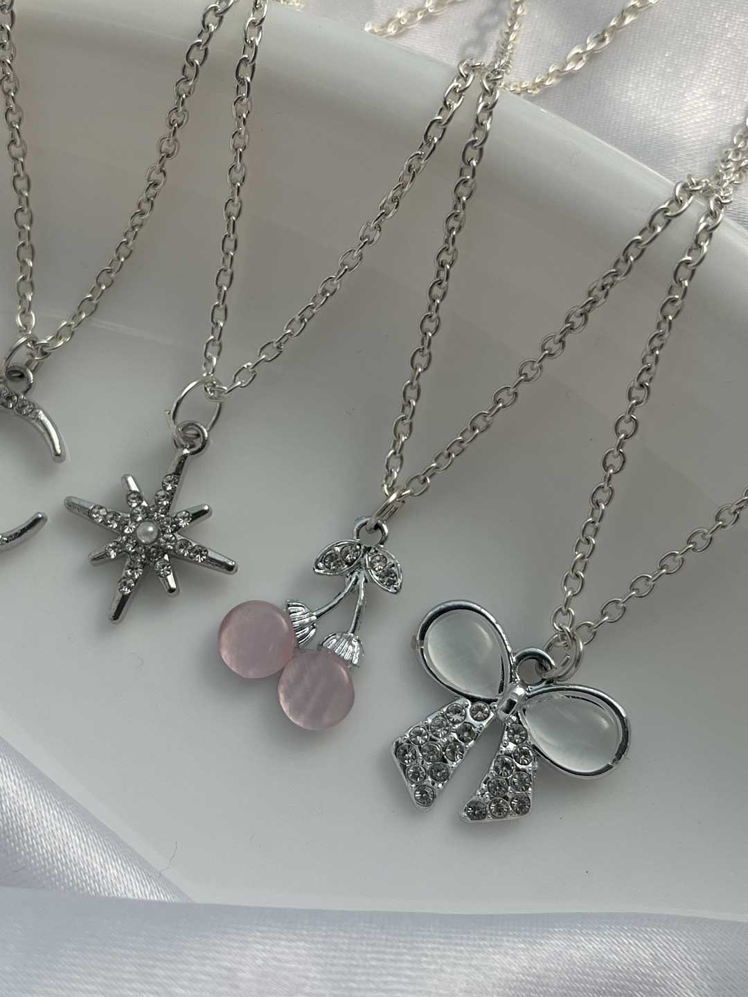 Jewelsbysirani Set Of 4 Silver-Plated American Diamond Studded Pendants With Chains
Jewelsbysirani Set Of 4 Silver-Plated American Diamond Studded Pendants With Chains
