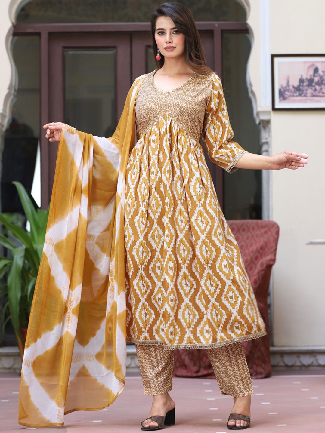 JAYRA TEXTILE Women Floral Printed Tiered Mirror Work Kurta with Palazzos & With Dupatta, Mustard
JAYRA TEXTILE Women Floral Printed Tiered Mirror Work Kurta with Palazzos & With Dupatta, Mustard
