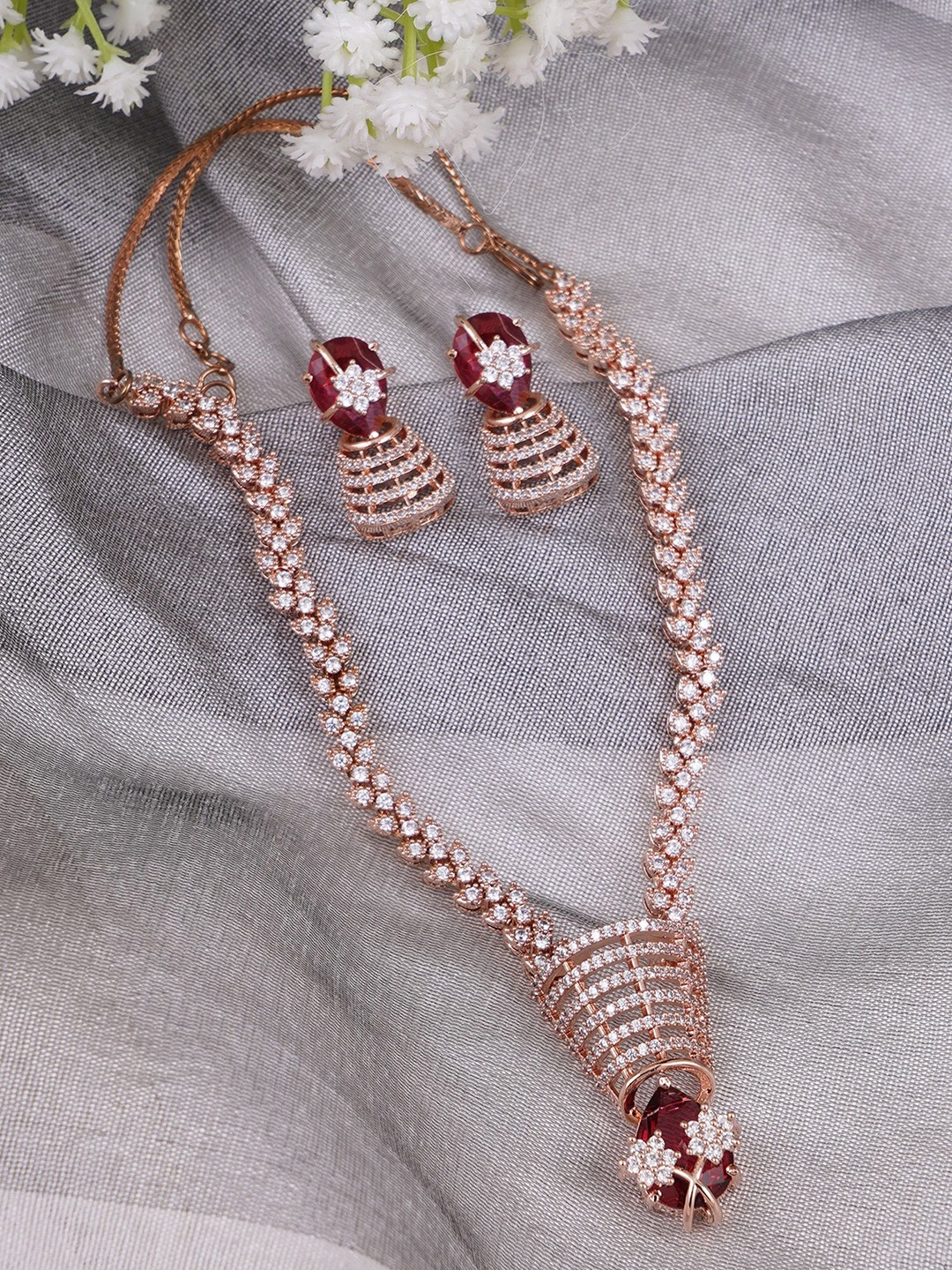Adwitiya Collection Rose Gold-Plated American Diamond Ruby & Kundan Studded Jewellery Set
Adwitiya Collection Rose Gold-Plated American Diamond Ruby & Kundan Studded Jewellery Set