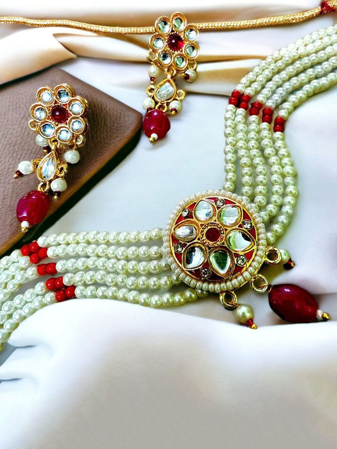RAJASTHANI GAHANA Gold-Plated Stones Studded & Beaded Jewellery Set
RAJASTHANI GAHANA Gold-Plated Stones Studded & Beaded Jewellery Set