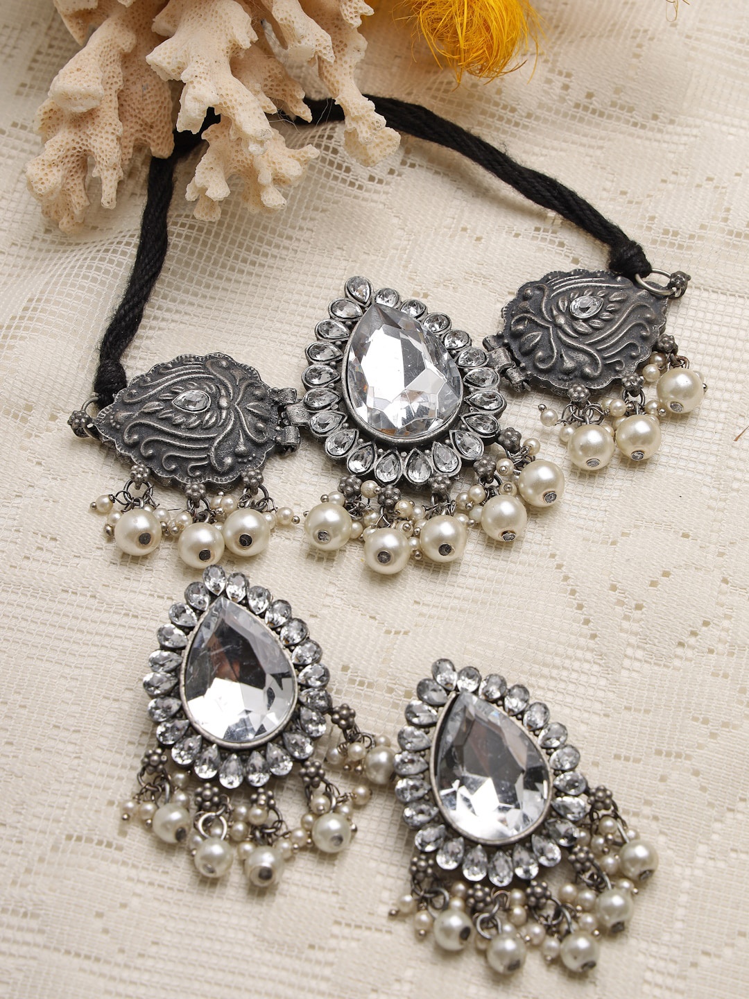 Moedbuille Silver-Plated Crystals & Pearls Studded Antique Tribal Design Oxidised Necklace Set
Moedbuille Silver-Plated Crystals & Pearls Studded Antique Tribal Design Oxidised Necklace Set
