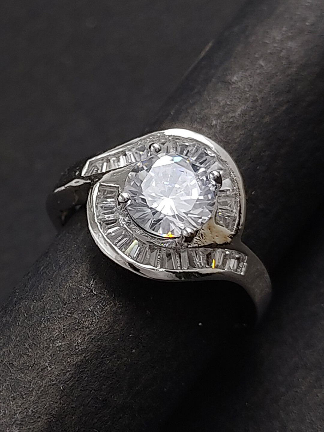 Saizen Rhodium-Plated Silver-Toned White AD -Studded Adjustable Finger Ring 
Saizen Rhodium-Plated Silver-Toned White AD -Studded Adjustable Finger Ring