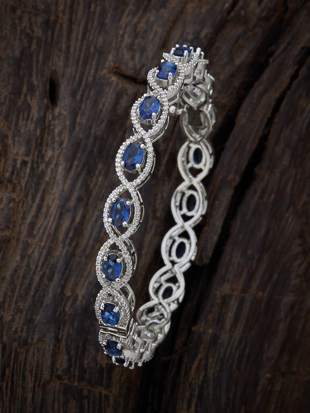 Kushal's Fashion Jewellery Rhodium-Plated & Silver-Toned Blue Artificial Stones Studded Kada Bangle
Kushal's Fashion Jewellery Rhodium-Plated & Silver-Toned Blue Artificial Stones Studded Kada Bangle