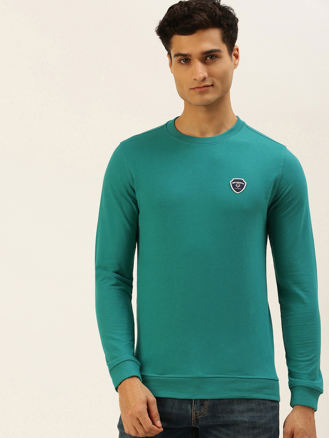 PETER ENGLAND UNIVERSITY Men Teal Green Solid Brand Logo Applique Slim Fit Sweatshirt
PETER ENGLAND UNIVERSITY Men Teal Green Solid Brand Logo Applique Slim Fit Sweatshirt