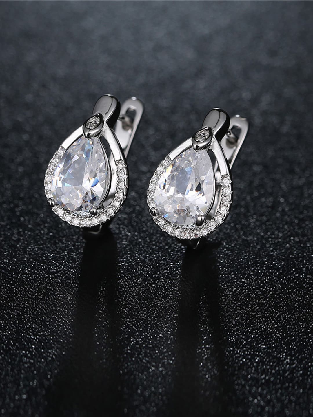 Designs By Jewels Galaxy Women Silver-Plated CZ Stone-Studded Teardrop Shaped Earrings
Designs By Jewels Galaxy Women Silver-Plated CZ Stone-Studded Teardrop Shaped Earrings