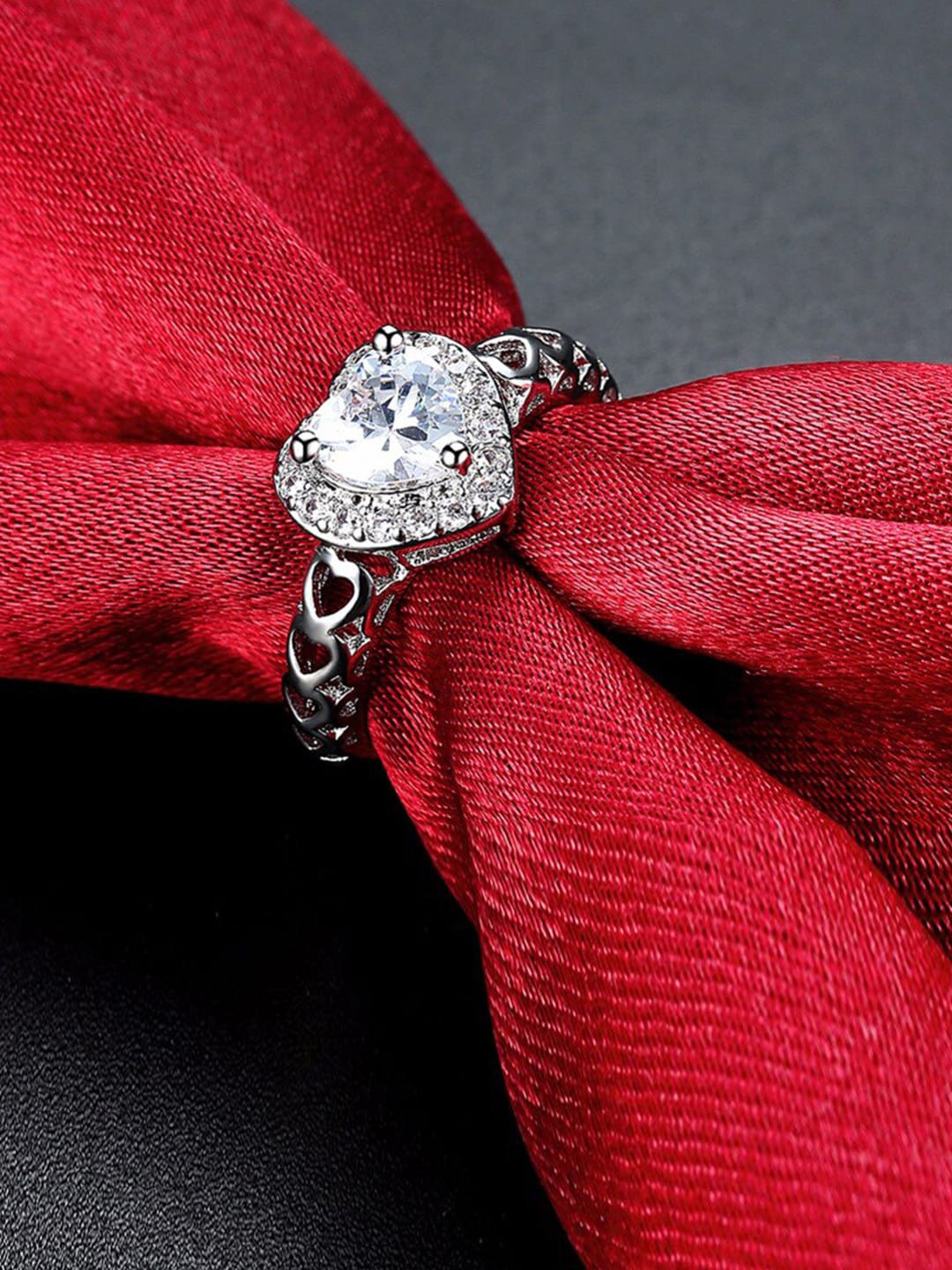 Designs By Jewels Galaxy Silver-Plated & Toned White CZ Studded Hear Shaped Finger Ring
Designs By Jewels Galaxy Silver-Plated & Toned White CZ Studded Hear Shaped Finger Ring