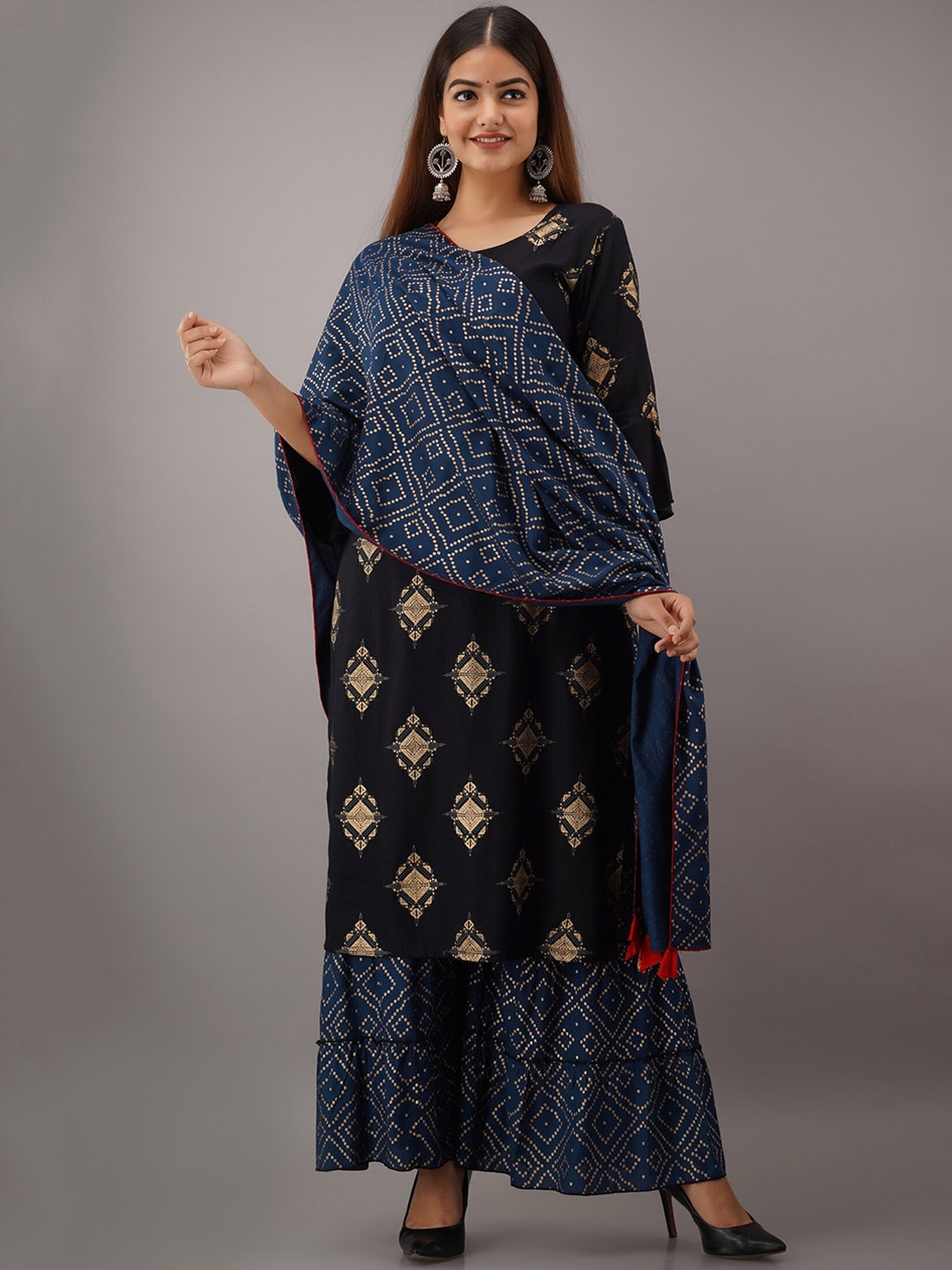 KALINI Women Black Ethnic Motifs Printed Aari Work Kurta with Sharara & With Dupatta
KALINI Women Black Ethnic Motifs Printed Aari Work Kurta with Sharara & With Dupatta