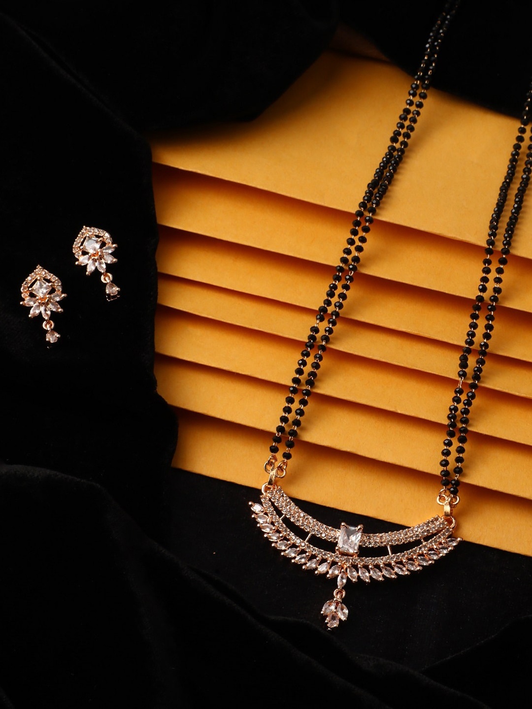 Vita Bella Women White & Black CZ Studded & Beaded Mangalsutra With Earrings, Rose gold
Vita Bella Women White & Black CZ Studded & Beaded Mangalsutra With Earrings, Rose gold