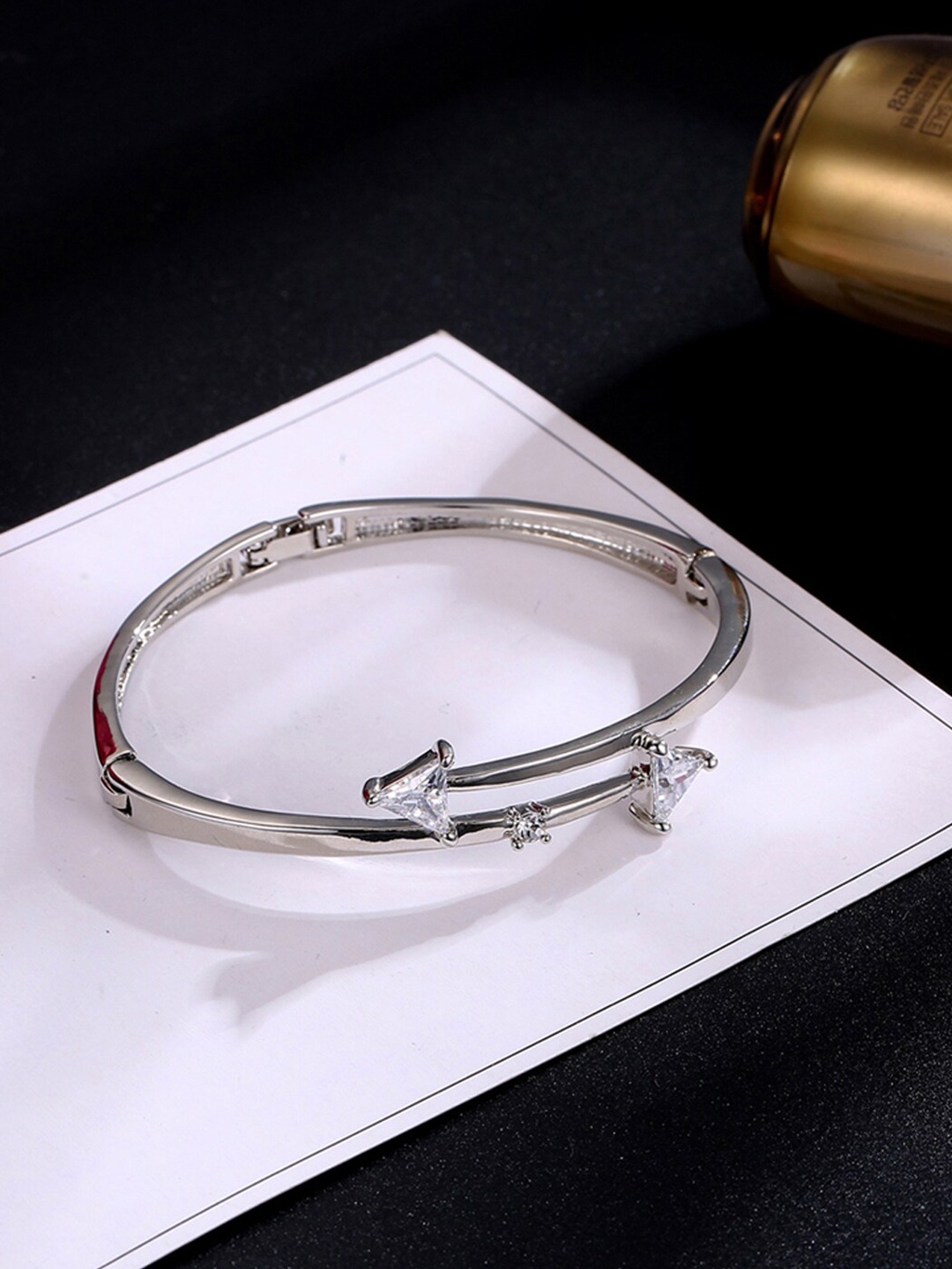 Designs By Jewels Galaxy Women Silver-Toned Brass American Diamond Silver-Plated Bangle-Style Bracelet
Designs By Jewels Galaxy Women Silver-Toned Brass American Diamond Silver-Plated Bangle-Style Bracelet
