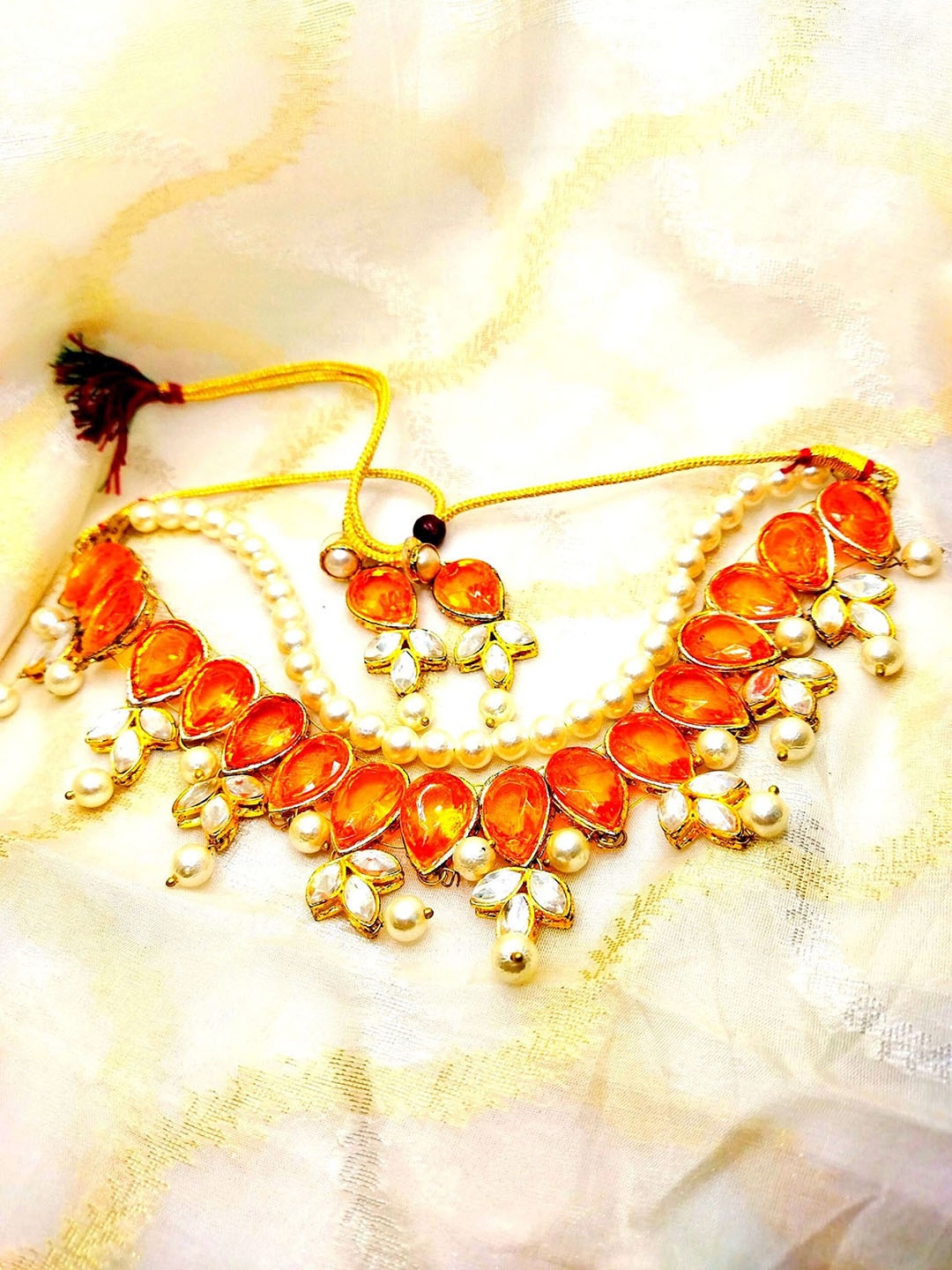 Kshitij Jewels Gold-Plated White & Orange Stone-Studded & Pearl Beaded Jewellery Set
Kshitij Jewels Gold-Plated White & Orange Stone-Studded & Pearl Beaded Jewellery Set