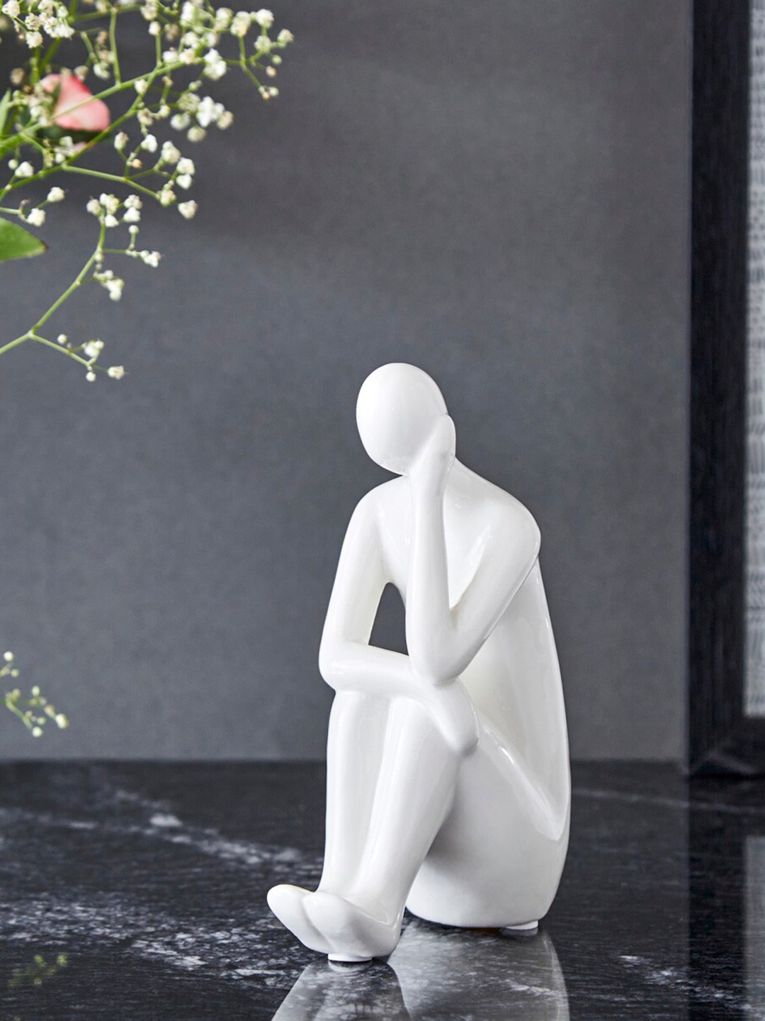 Home Centre White Sitting Man Showpieces