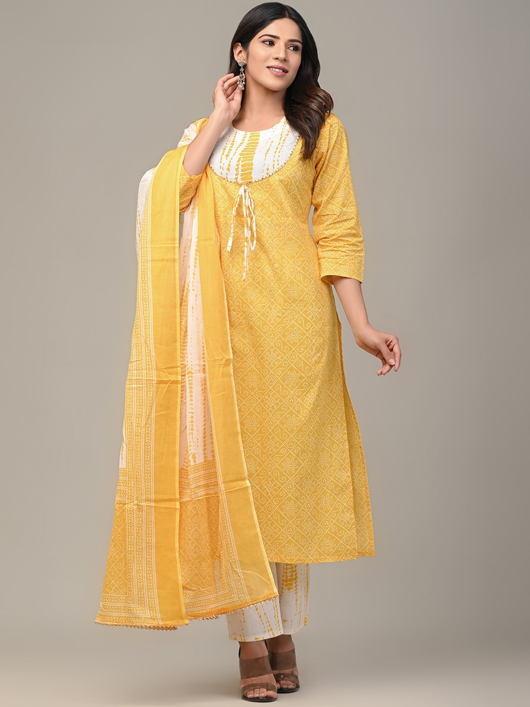 FERANOID Women Yellow Bandhani Printed Pure Cotton Kurta with Trousers & With Dupatta
FERANOID Women Yellow Bandhani Printed Pure Cotton Kurta with Trousers & With Dupatta