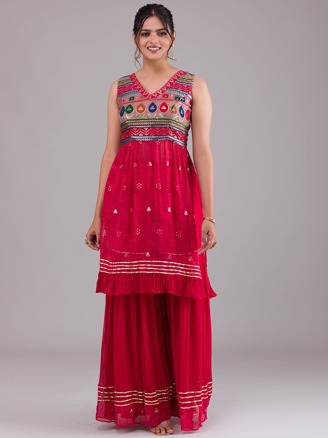 Koskii Women Red Ethnic Motifs Embroidered Pleated Sequinned Kurta with Sharara & With Dupatta
Koskii Women Red Ethnic Motifs Embroidered Pleated Sequinned Kurta with Sharara & With Dupatta