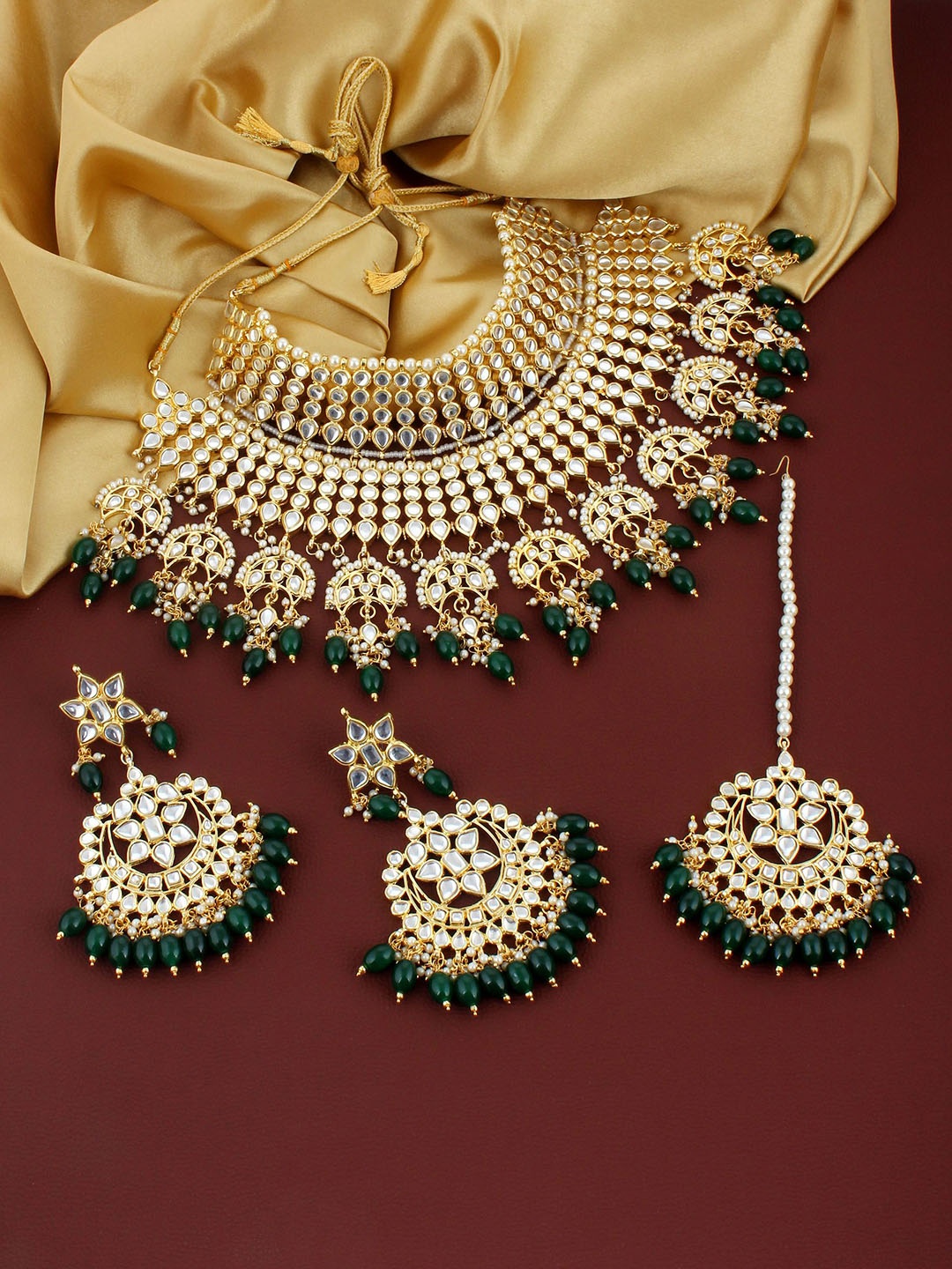 LUCKY JEWELLERY Gold-Plated Gold-Toned Green Kundan Studded &Pearl Studded Jewellery Set
LUCKY JEWELLERY Gold-Plated Gold-Toned Green Kundan Studded &Pearl Studded Jewellery Set