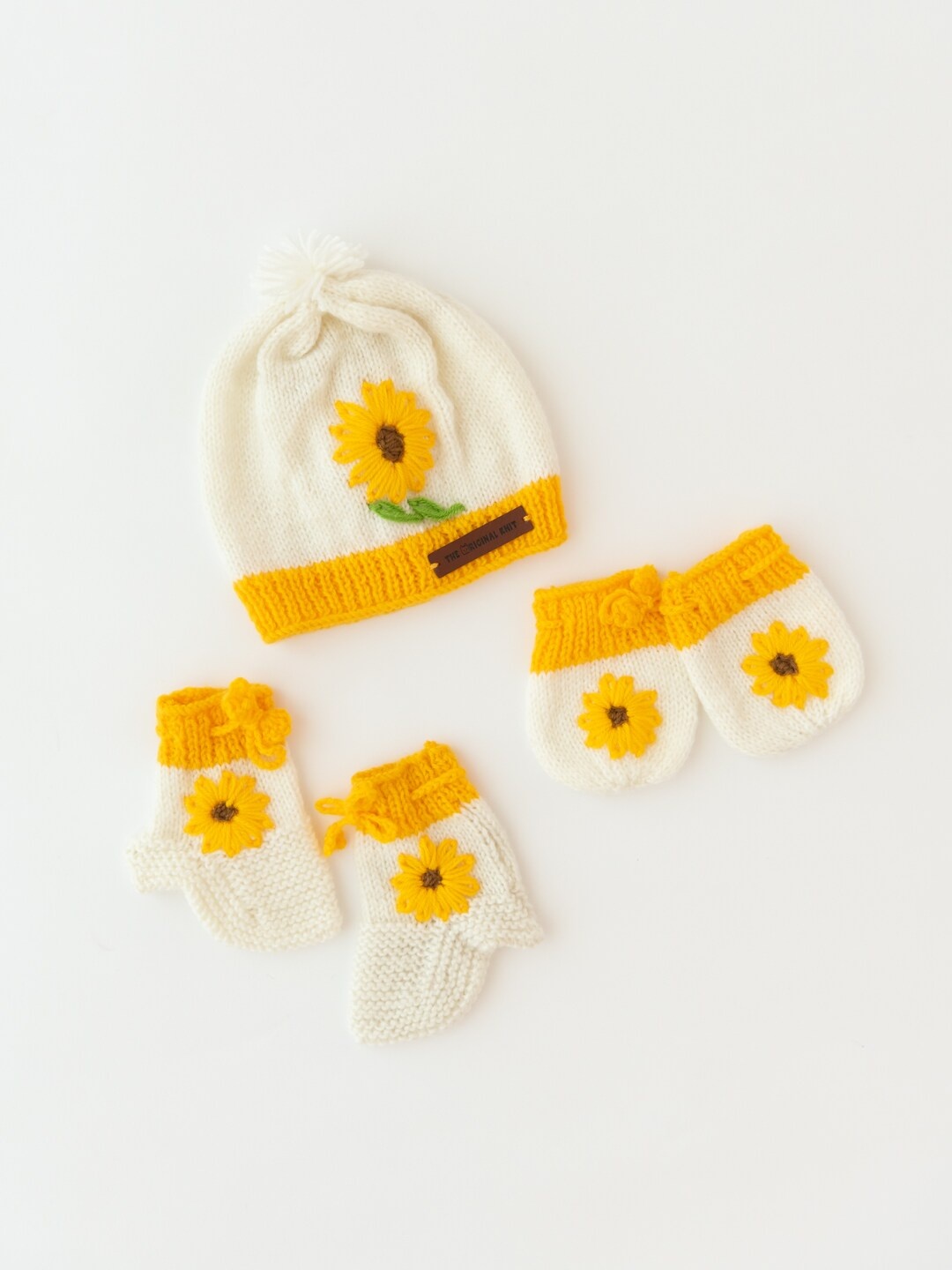 The Original Knit Kids White & Yellow Self Design Acrylic Beanie Cap With Socks & Mittens
The Original Knit Kids White & Yellow Self Design Acrylic Beanie Cap With Socks & Mittens