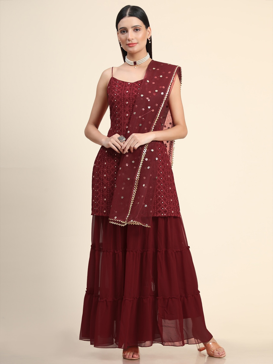 KALINI Women Maroon Floral Embroidered Thread Work Kurta with Sharara & With Dupatta
KALINI Women Maroon Floral Embroidered Thread Work Kurta with Sharara & With Dupatta