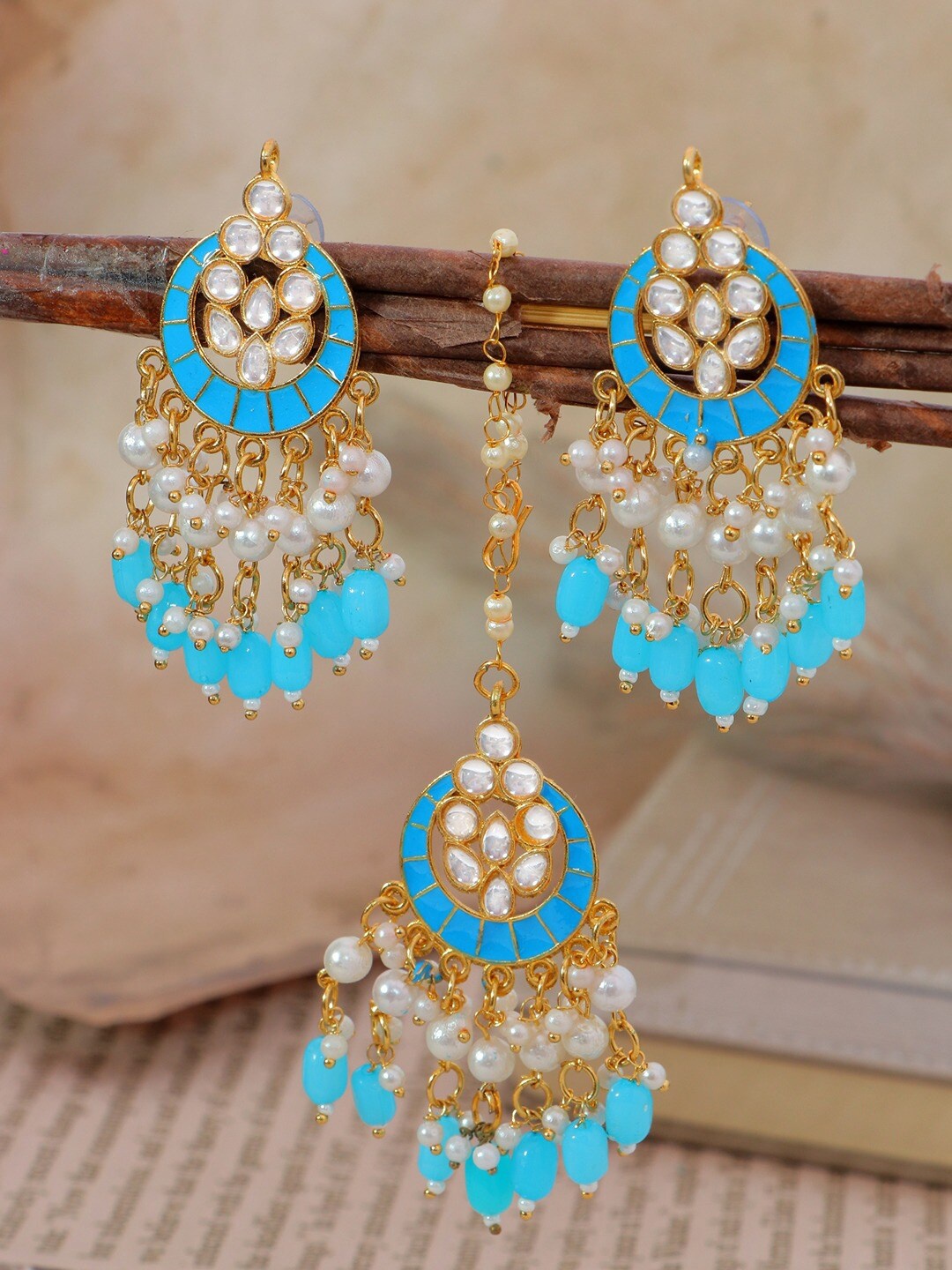 Crunchy Fashion Women Turquoise Blue & White Gold-Plated Kundan Maang Tika and Earrings
Crunchy Fashion Women Turquoise Blue & White Gold-Plated Kundan Maang Tika and Earrings