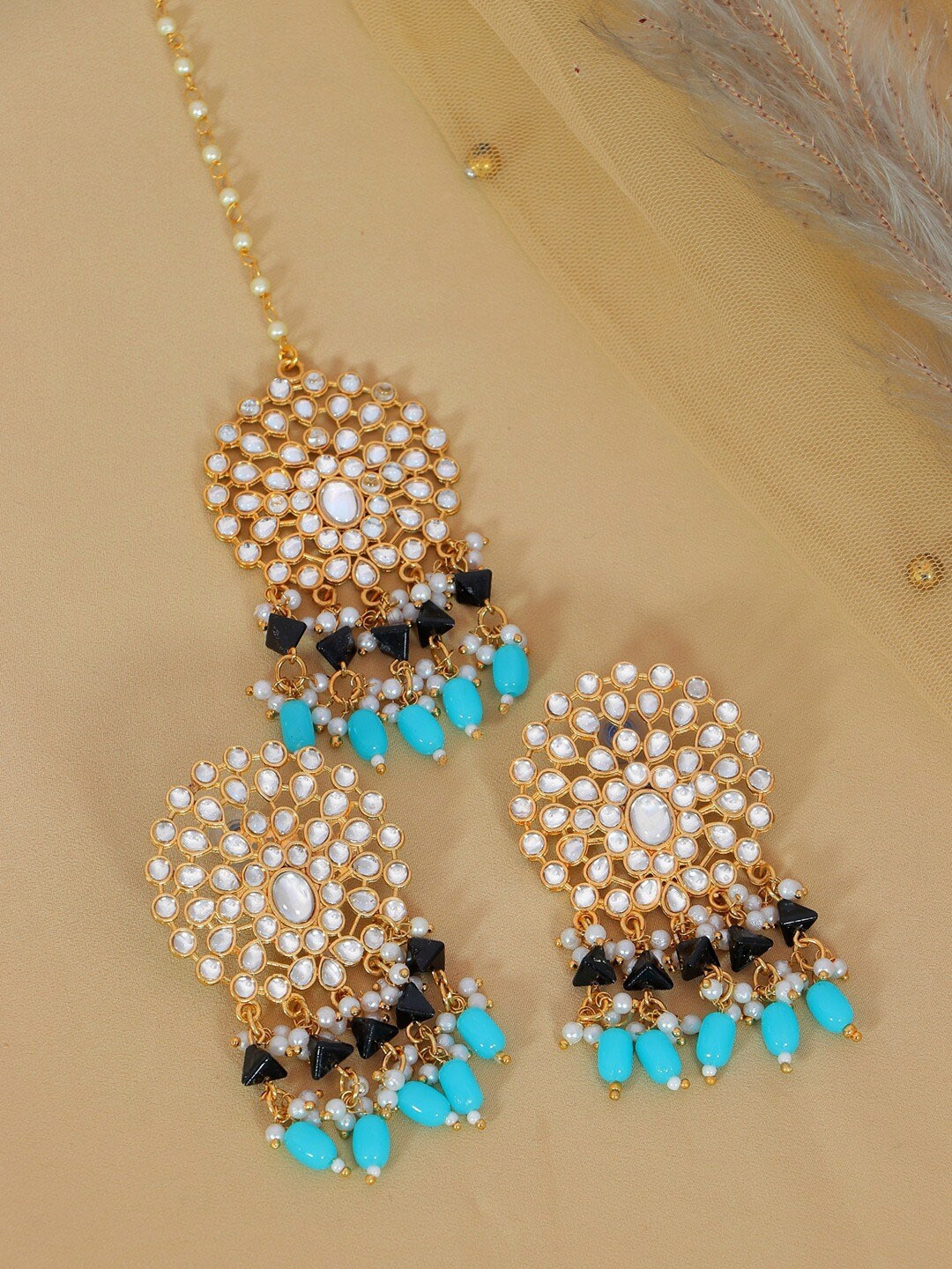 Crunchy Fashion Women White & Turquoise Blue Gold-Plated Kundan Maang Tika and Earrings
Crunchy Fashion Women White & Turquoise Blue Gold-Plated Kundan Maang Tika and Earrings