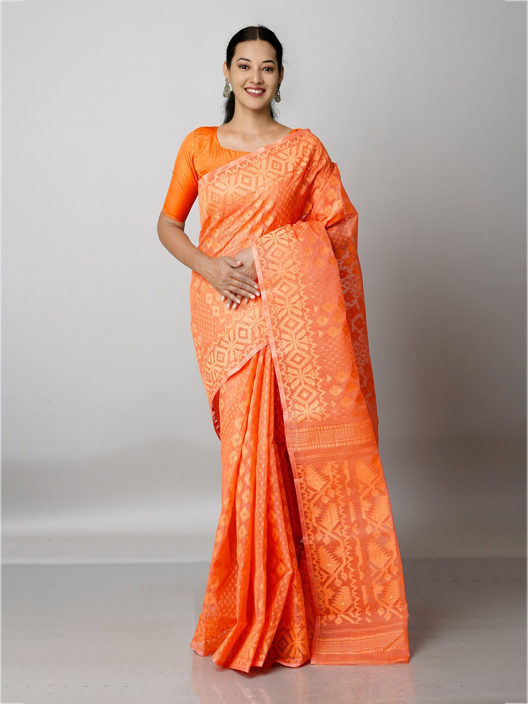 Unnati Silks Orange & Gold-Toned Woven Design Pure Cotton Handloom Jamdani Zari Saree
Unnati Silks Orange & Gold-Toned Woven Design Pure Cotton Handloom Jamdani Zari Saree