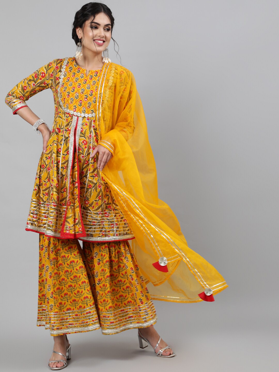 INDIE CLOSET Women Yellow Floral Printed Layered Gotta Patti Pure Cotton Kurta with Sharara & With Dupatta
INDIE CLOSET Women Yellow Floral Printed Layered Gotta Patti Pure Cotton Kurta with Sharara & With Dupatta