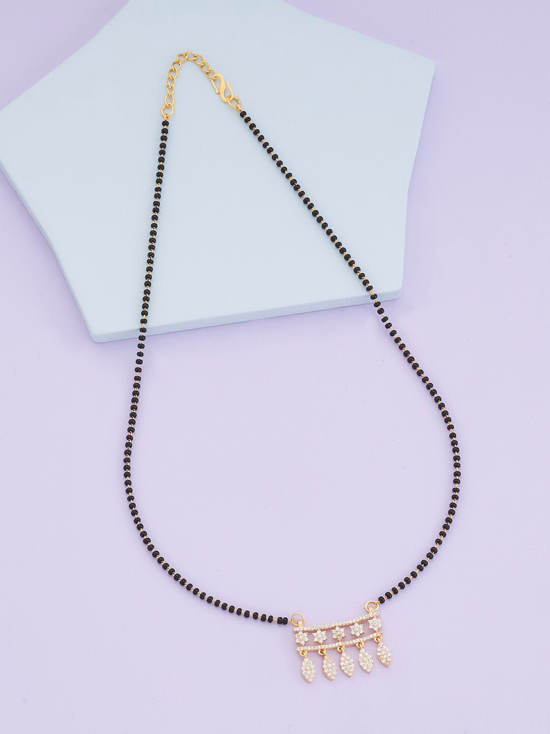 Kushals Fashion Jewellery Gold-Plated White & Black Stone-Studded & Beaded Mangalsutra
Kushals Fashion Jewellery Gold-Plated White & Black Stone-Studded & Beaded Mangalsutra
