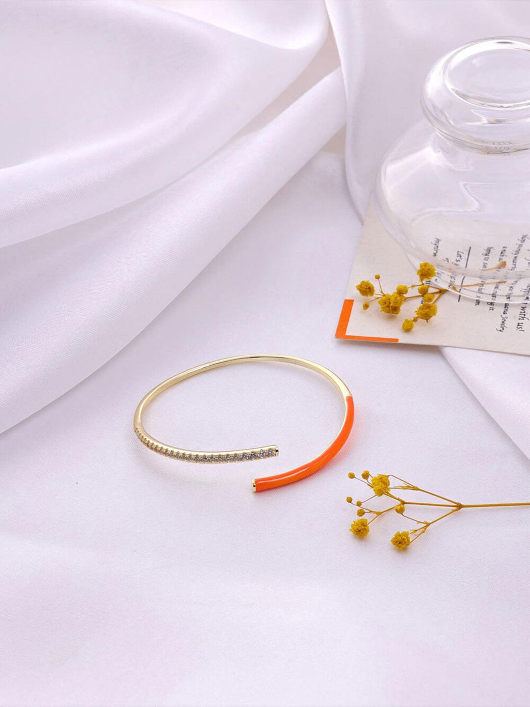 Mitali Jain Women Gold-Toned & Orange Brass Cubic Zirconia Gold-Plated Cuff Bracelet
Mitali Jain Women Gold-Toned & Orange Brass Cubic Zirconia Gold-Plated Cuff Bracelet
