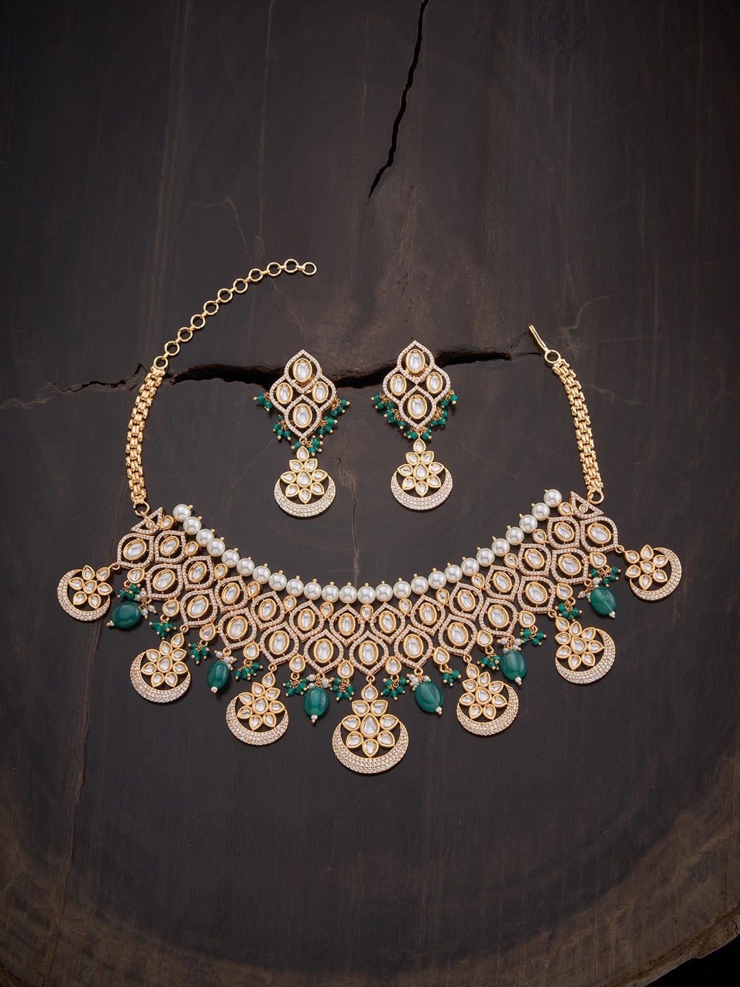 Kushal's Fashion Jewellery Women Gold-Plated Green Kundan & CZ-Studded Jewellery Set
Kushal's Fashion Jewellery Women Gold-Plated Green Kundan & CZ-Studded Jewellery Set