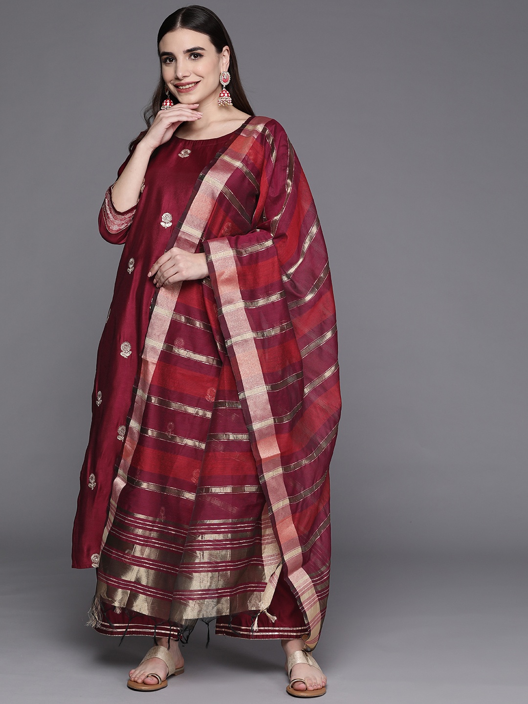 Indo Era Women Burgundy & Golden Ethnic Motifs Embroidered Kurta with Palazzos & Dupatta
Indo Era Women Burgundy & Golden Ethnic Motifs Embroidered Kurta with Palazzos & Dupatta