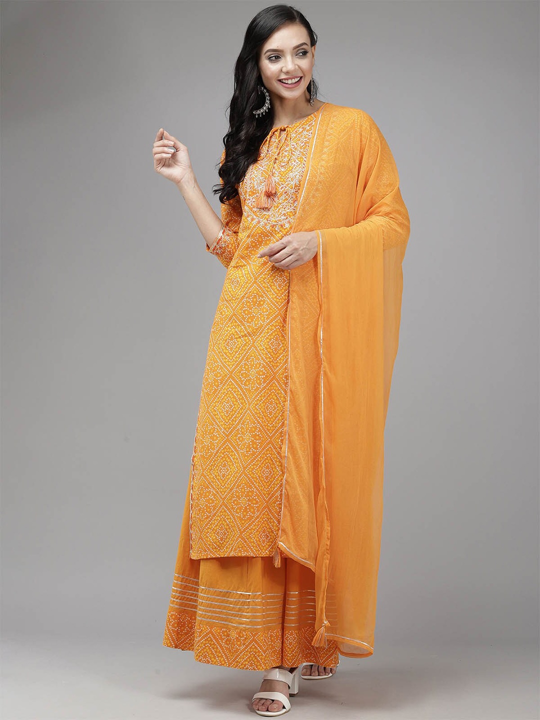 ODETTE Women Orange Bandhani Printed Gotta Patti Kurta with Palazzos & With Dupatta
ODETTE Women Orange Bandhani Printed Gotta Patti Kurta with Palazzos & With Dupatta