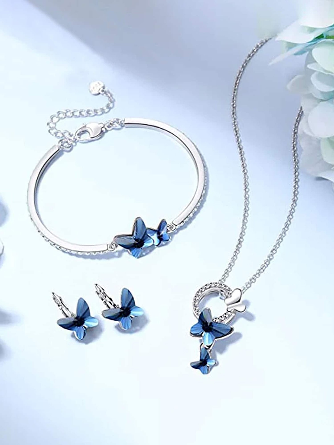 Yellow Chimes Silver-Tone Crystal Studded Butterfly Pendant With Earrings & Bracelet, Blue
Yellow Chimes Silver-Tone Crystal Studded Butterfly Pendant With Earrings & Bracelet, Blue