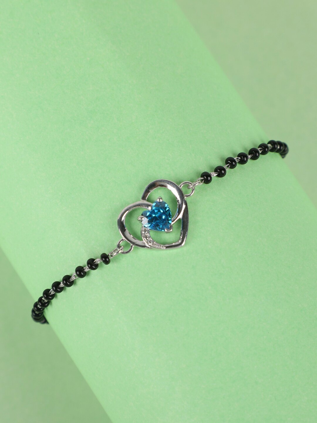 Clara Women Black Sterling Silver Cubic Zirconia Rhodium-Plated Heart Mangalsutra Bracelet
Clara Women Black Sterling Silver Cubic Zirconia Rhodium-Plated Heart Mangalsutra Bracelet
