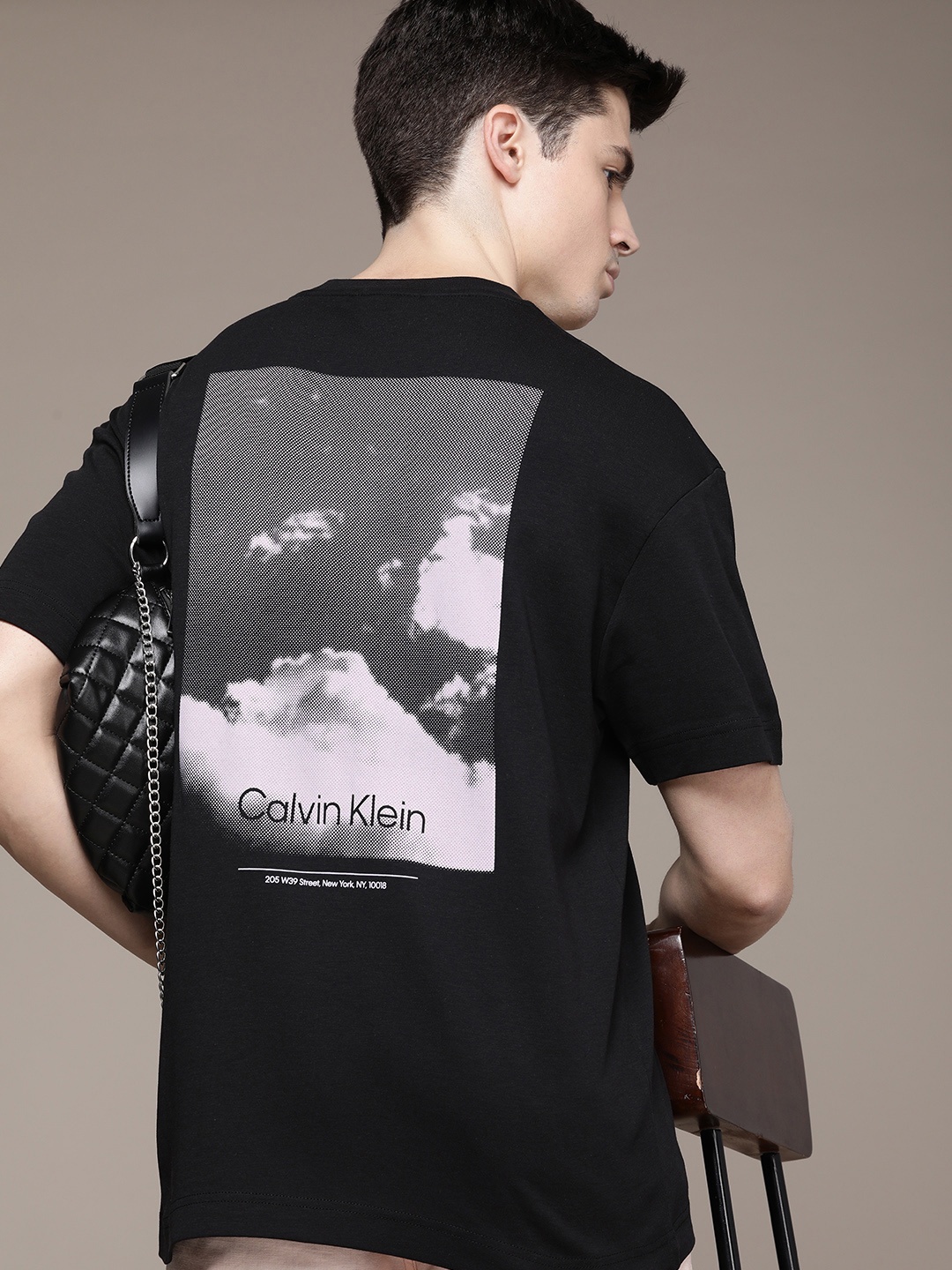 Calvin Klein Jeans Graphic Back Print Drop-Shoulder Sleeves Pure Cotton T-shirt, Black
Calvin Klein Jeans Graphic Back Print Drop-Shoulder Sleeves Pure Cotton T-shirt, Black