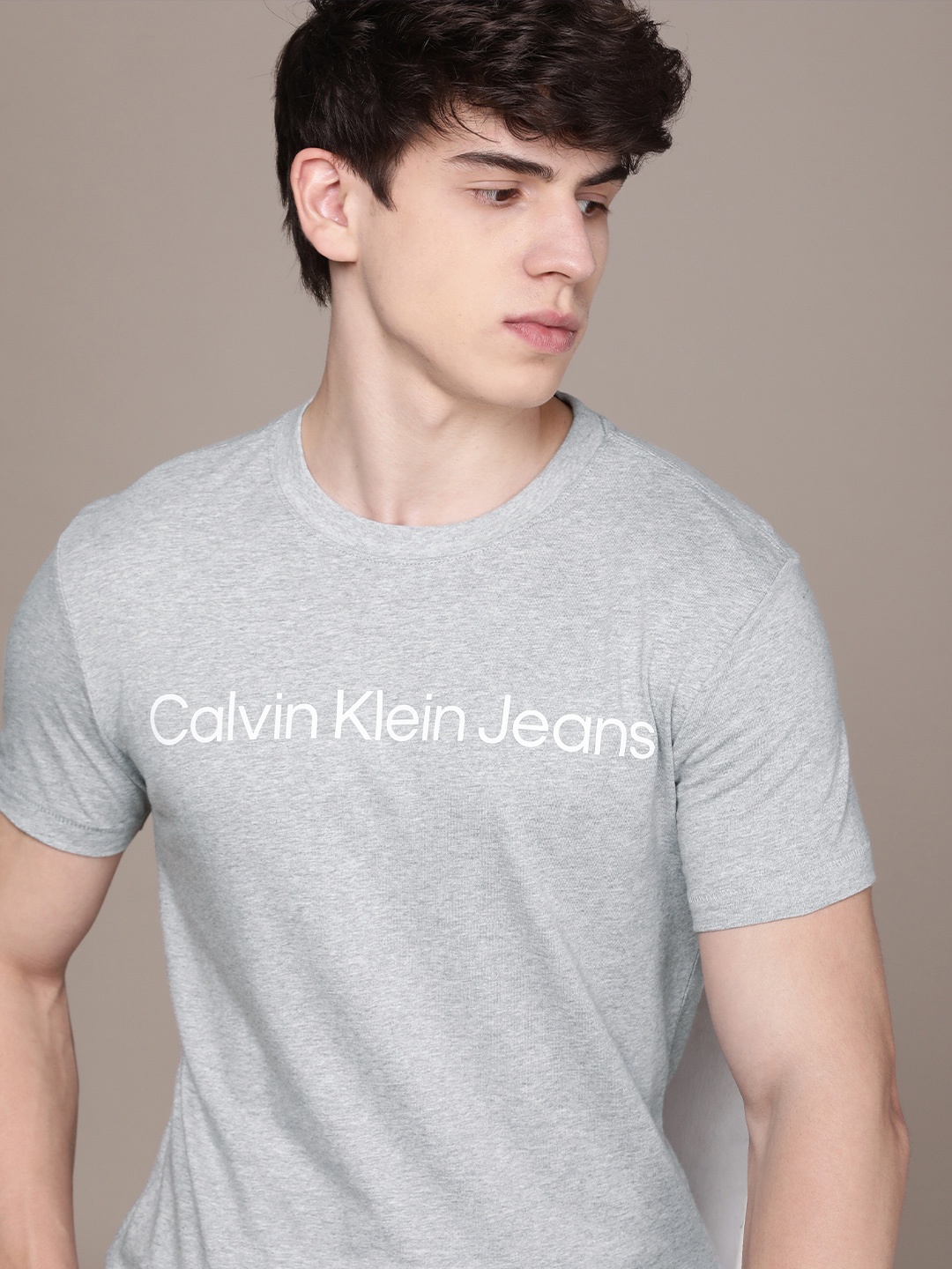Calvin Klein Jeans Round Neck Typography Printed Pure Cotton Slim Fit T-shirt, Grey melange
Calvin Klein Jeans Round Neck Typography Printed Pure Cotton Slim Fit T-shirt, Grey melange