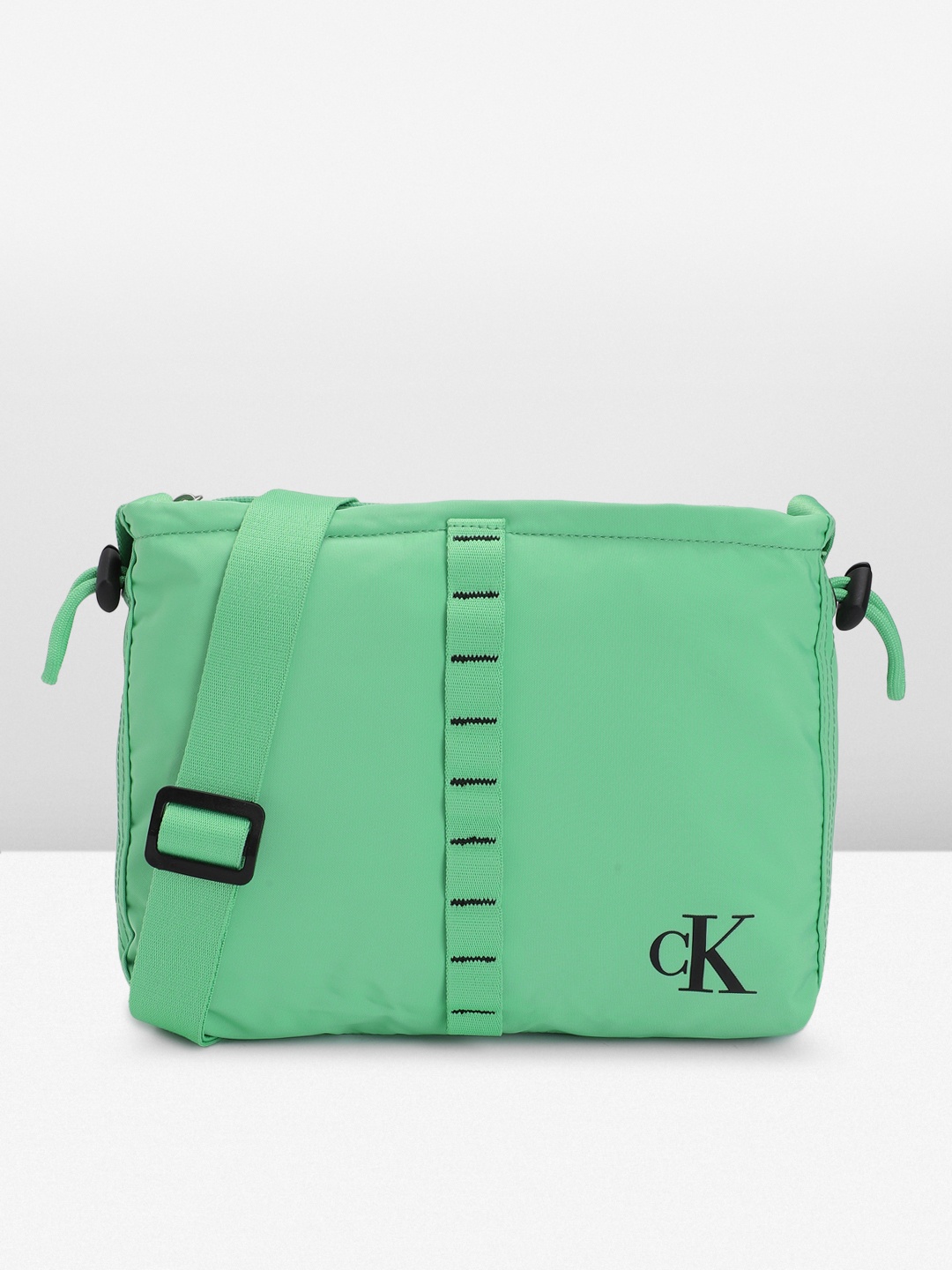 Calvin Klein Solid Structured Sling Bag with Cinched Applique Detail & Toggle, Green
Calvin Klein Solid Structured Sling Bag with Cinched Applique Detail & Toggle, Green