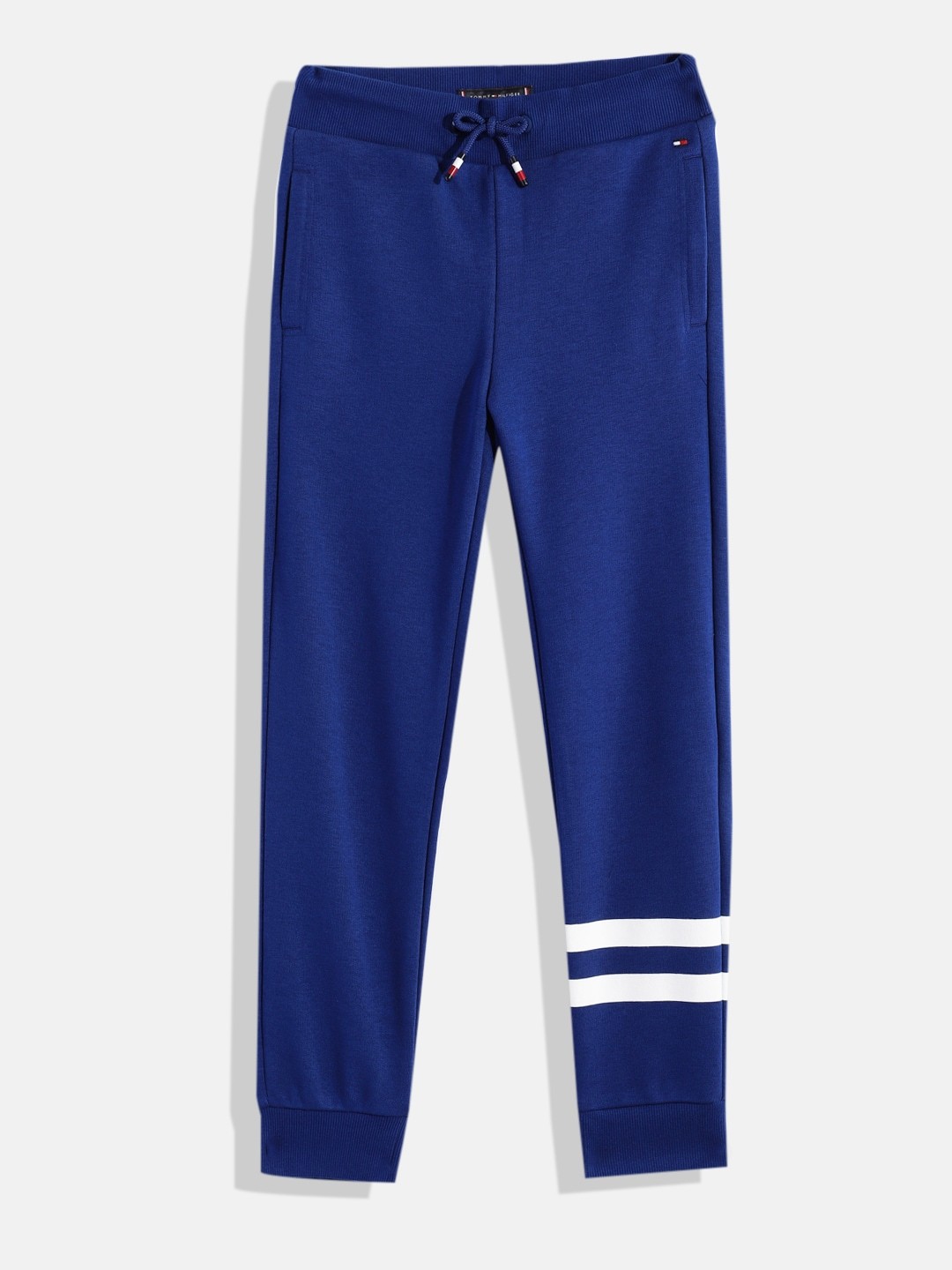 Tommy Hilfiger Boys Solid Regular Fit Mid-Rise Knitted Sweat Joggers With Striped Detail, Blue
Tommy Hilfiger Boys Solid Regular Fit Mid-Rise Knitted Sweat Joggers With Striped Detail, Blue