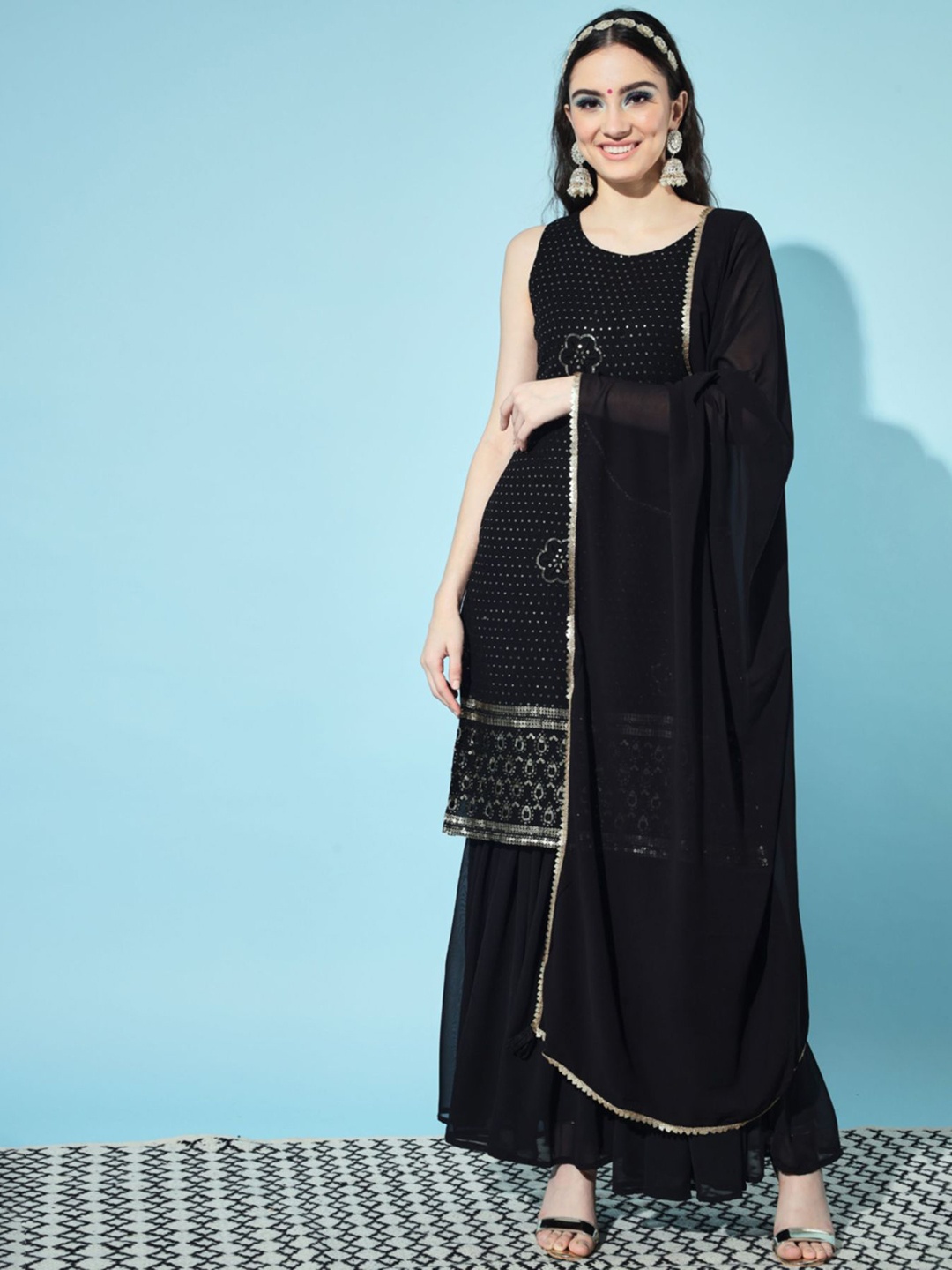 Shopping Queen Women Black Floral Embroidered Sequinned Kurta with Sharara & Dupatta
Shopping Queen Women Black Floral Embroidered Sequinned Kurta with Sharara & Dupatta