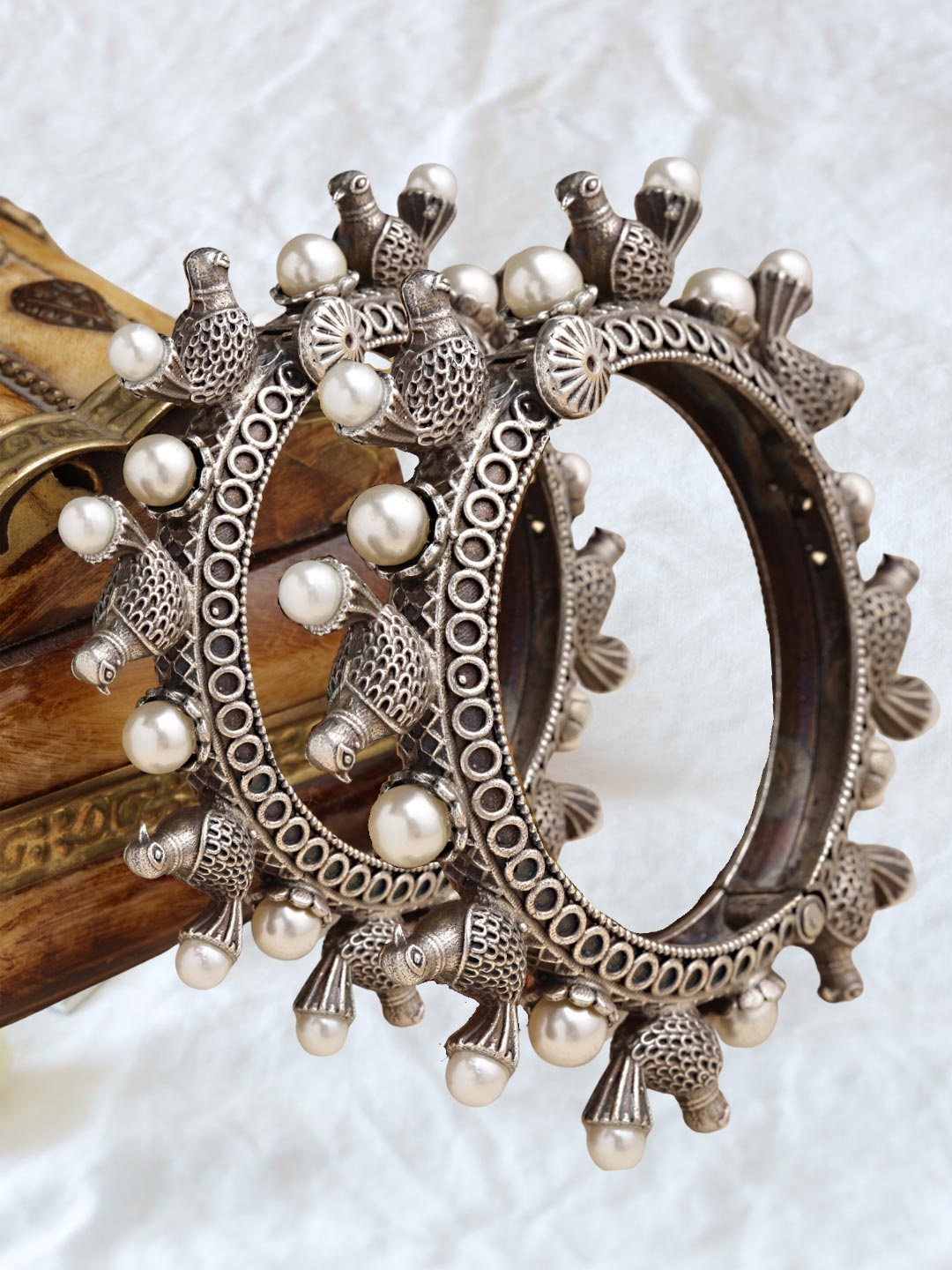 Sanjog Set Of 2 Silver-Toned & White Silver-Plated Pearl Studded Antique Adjustable Bangle
Sanjog Set Of 2 Silver-Toned & White Silver-Plated Pearl Studded Antique Adjustable Bangle