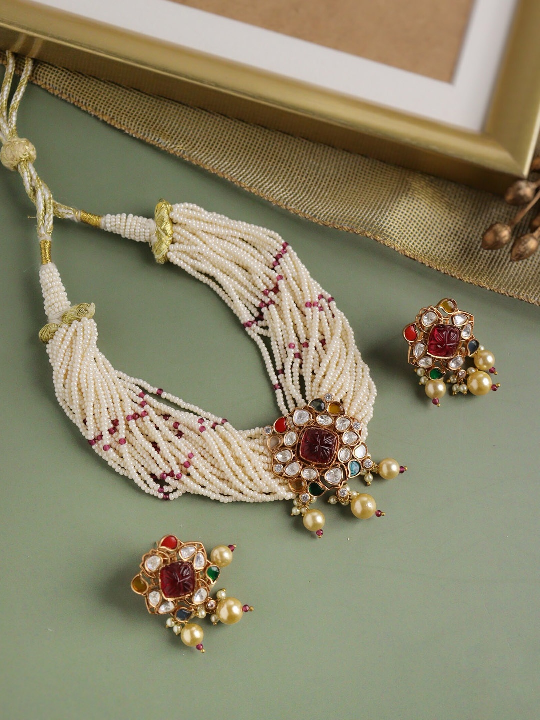 CURIO COTTAGE Gold-Plated Kundan & Navratan Stone-Studded Pearl Beaded Choker Jewellery Set
CURIO COTTAGE Gold-Plated Kundan & Navratan Stone-Studded Pearl Beaded Choker Jewellery Set