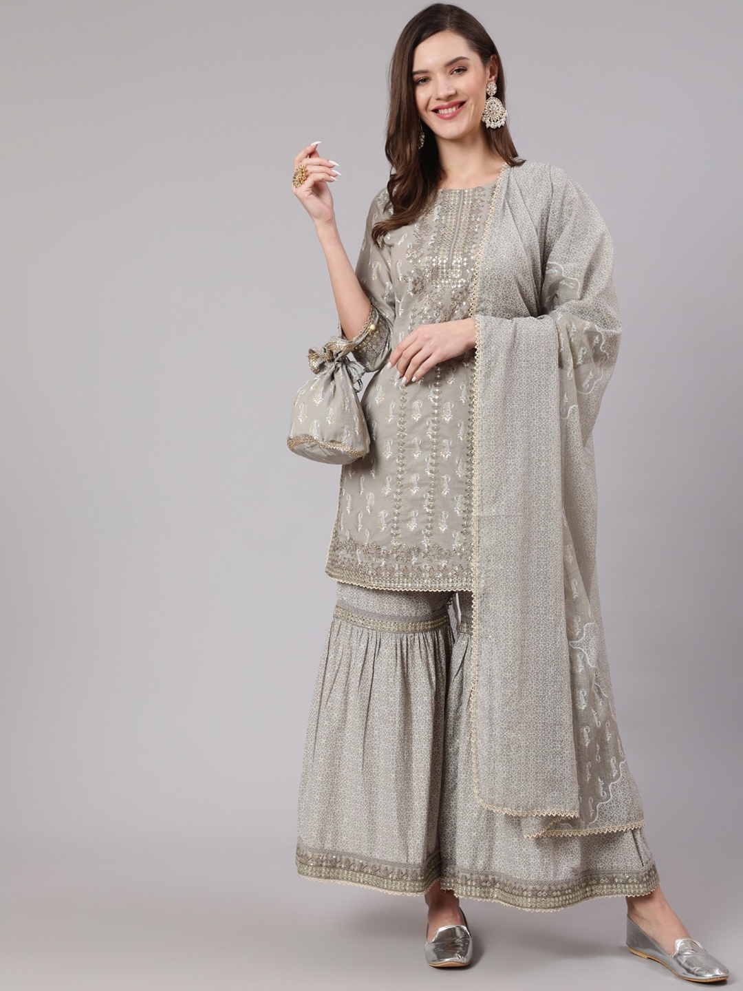 KALINI Ethnic Motifs Embroidered Sequinned Pure Cotton Kurta with Sharara & With Dupatta, Grey
KALINI Ethnic Motifs Embroidered Sequinned Pure Cotton Kurta with Sharara & With Dupatta, Grey