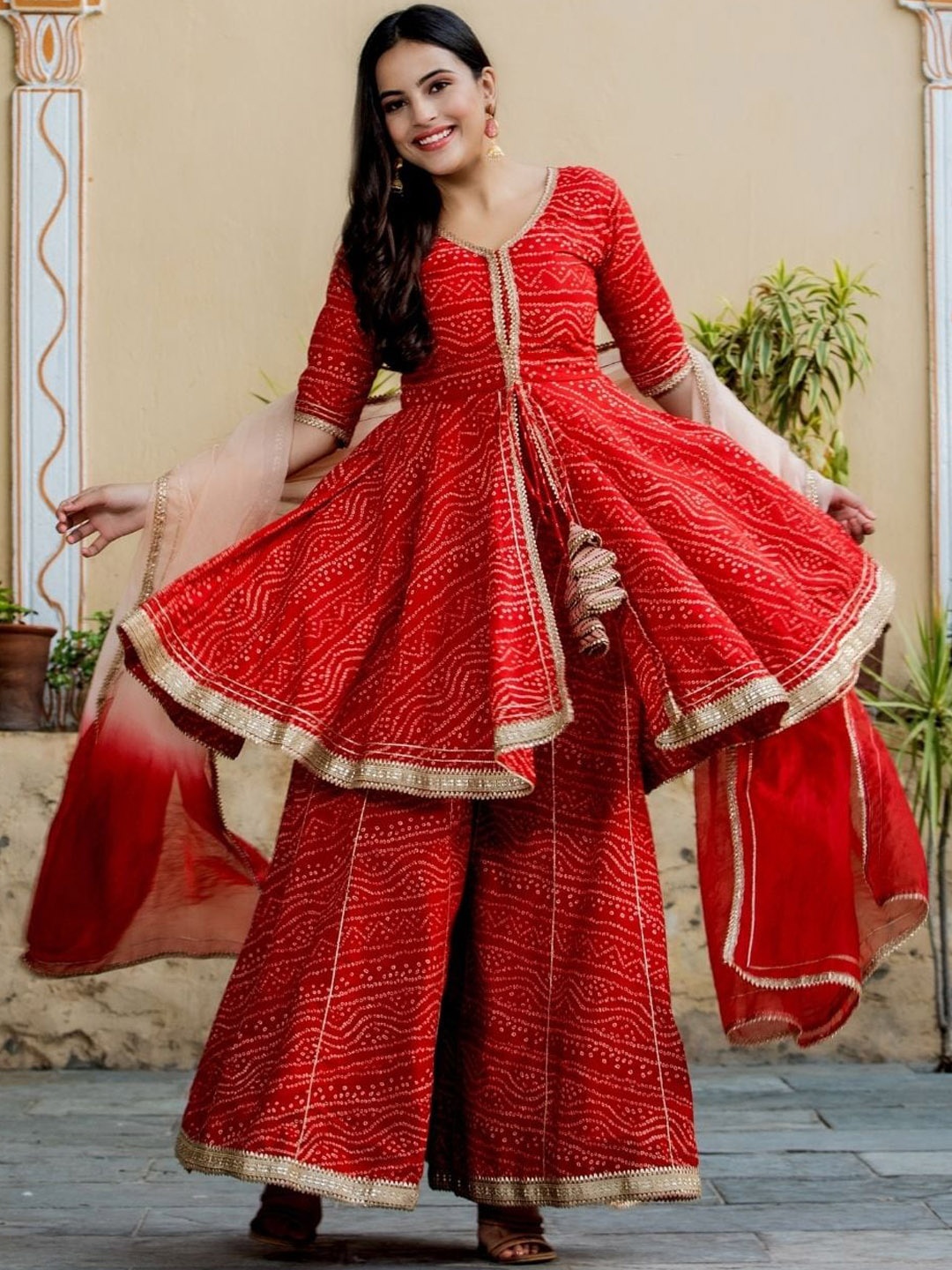 HOUSE OF JAMOTI Women Bandhani Printed Pleated Gotta Patti Kurta with Sharara & Dupatta, Red
HOUSE OF JAMOTI Women Bandhani Printed Pleated Gotta Patti Kurta with Sharara & Dupatta, Red