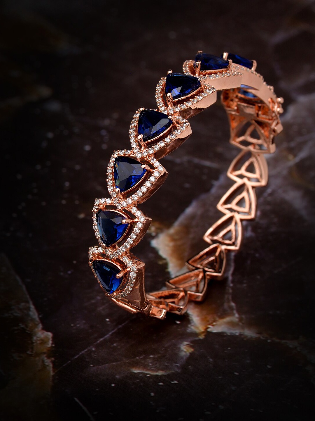 Saraf RS Jewellery Women Rose & Blue Brass Cubic Zirconia Handcrafted Rose Gold-Plated Bangle-Style Bracelet
Saraf RS Jewellery Women Rose & Blue Brass Cubic Zirconia Handcrafted Rose Gold-Plated Bangle-Style Bracelet