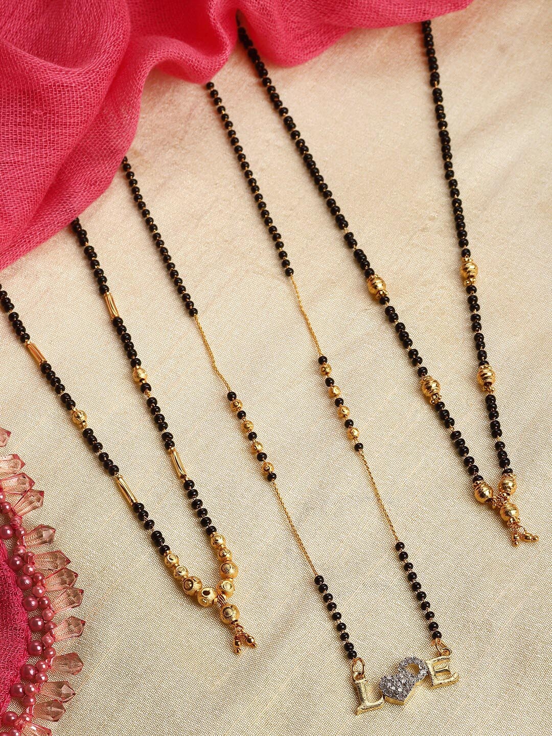 Kennice Set Of 3 Gold-Plated American Diamond Studded & Beaded Mangalsutra, Black
Kennice Set Of 3 Gold-Plated American Diamond Studded & Beaded Mangalsutra, Black
