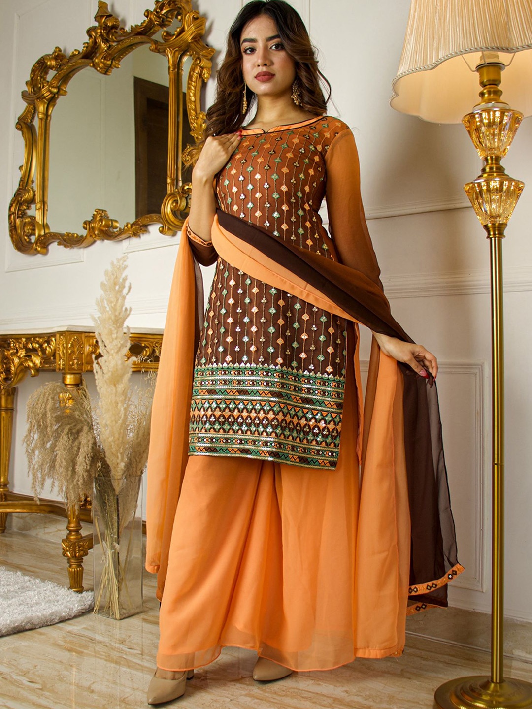 Vidraa Western Store Women Brown Ethnic Motifs Embroidered Sequinned Kurta with Palazzos & With Dupatta
Vidraa Western Store Women Brown Ethnic Motifs Embroidered Sequinned Kurta with Palazzos & With Dupatta