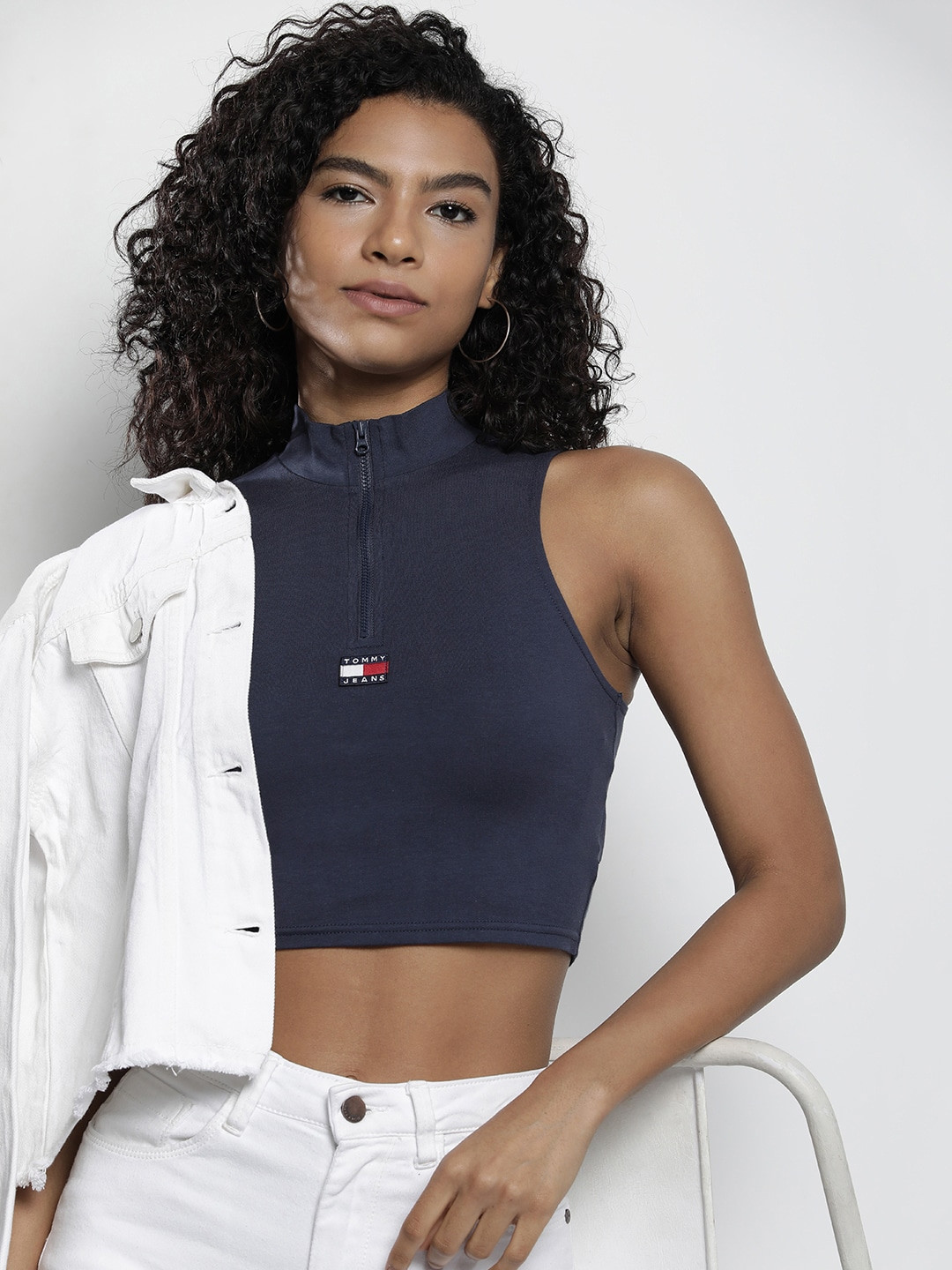 Tommy Hilfiger Solid High Neck Sleeveless Fitted Crop Top With Applique Detail, Navy blue
Tommy Hilfiger Solid High Neck Sleeveless Fitted Crop Top With Applique Detail, Navy blue