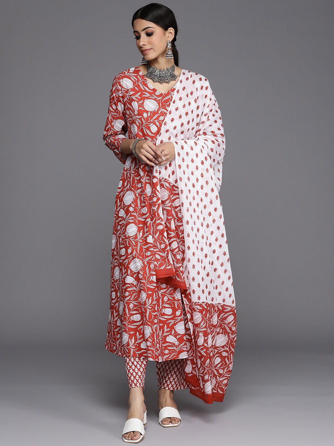 KALINI Floral Printed Pure Cotton Anarkali Kurta with Trousers & Dupatta Set, Rust
KALINI Floral Printed Pure Cotton Anarkali Kurta with Trousers & Dupatta Set, Rust